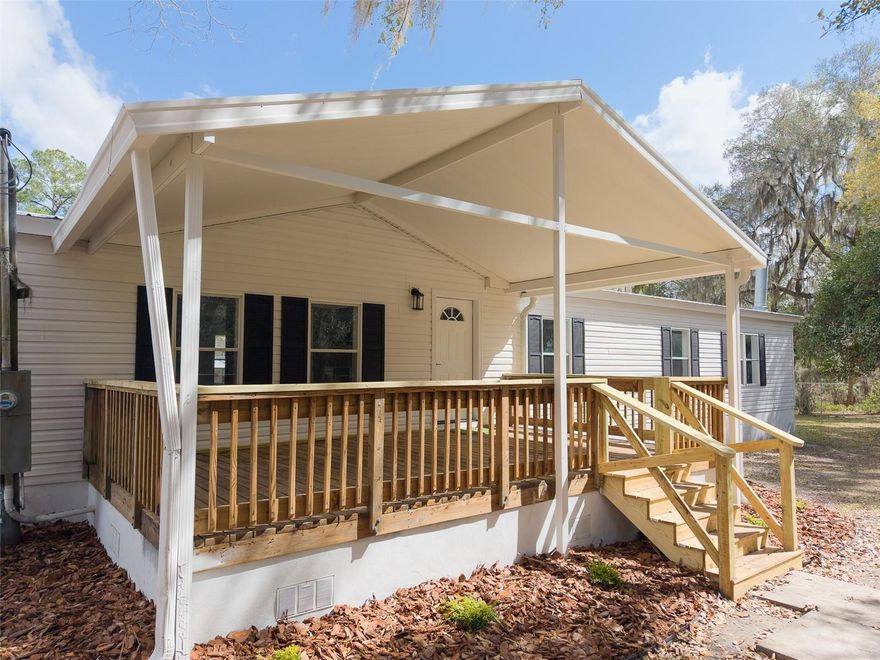 NEWLY RENOVATED 4 bedroom 2 bath manufactured home located in Waldo, Fl. Set on a spacious .54 acre lot, it features 2356 square feet of living space and an expansive front covered porch. Inside the home you'll find updated flooring throughout, all new fixtures, and fresh paint. The gourmet kitchen sits behind segmented arches and features a large island, a large pantry, new appliances and all new solid wood cabinetry with quartz countertops. The primary bedroom offers plenty of space and features an en suite bath with dual vanities, walk-in shower and oversized walk-in closet. 3 additional guest bedrooms, a private laundry room, and 2nd living/media room complete the package. Call to schedule your tour today!