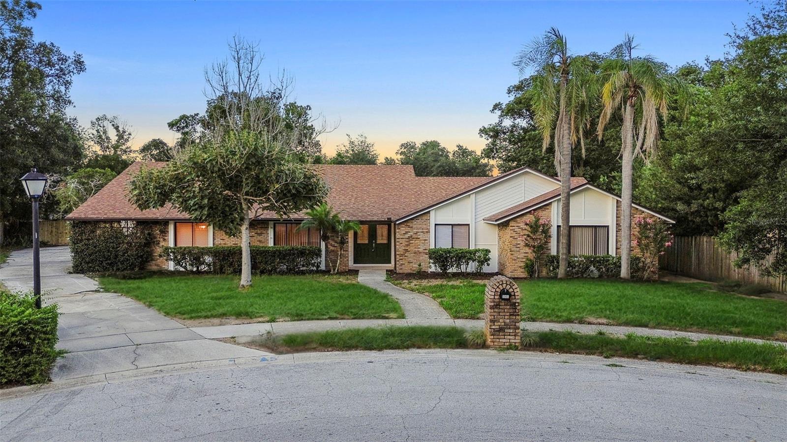 Welcome to this beautifully renovated 4-bedroom, 2.5-bath residence, ideally situated on nearly half an acre in the highly desirable Sabal Point Whisper Wood community. Nestled among mature shade trees and lush landscaping, this home offers the perfect blend of tranquility, space, and convenience—all with low HOA dues.
From the moment you arrive, you’ll be impressed by the expansive three-car garage and extended driveway, providing ample parking for family and guests. Step inside to discover a thoughtfully designed floor plan, beginning with a formal living and dining area—ideal for hosting gatherings or creating lasting memories with loved ones.
The adjacent family room is a true highlight, featuring soaring angled ceilings, a striking brick fireplace, and an abundance of natural light that enhances the inviting atmosphere throughout the home. The fully updated kitchen combines style and functionality, boasting rich wood cabinetry, granite countertops, a built-in oven and microwave, a tasteful tile backsplash, and a breakfast bar—perfect for enjoying your morning coffee or casual conversations.
The spacious primary suite is a luxurious retreat, complete with an oversized walk-in closet and a spa-inspired en-suite bath showcasing a large walk-in shower. Three additional bedrooms provide flexible space to accommodate family, guests, or to customize as a home office, gym, or creative studio.
Enjoy year-round versatility in the oversized Florida room, perfect as a sunlit workspace, indoor garden, or relaxed lounge. Step outside to the screened lanai where you can dine al fresco, unwind in the sparkling pool and spa, or bask in the Florida sunshine. The fully fenced backyard offers generous space for entertaining, outdoor activities, or creating your personal oasis—think weekend BBQs, cozy firepit evenings, or a safe space for pets to play.
Located in a well-established neighborhood with convenient access to shopping, dining, parks, and top-rated schools, this home truly has it all. Don’t miss the opportunity to make this exceptional property your forever home. Schedule your private showing today!