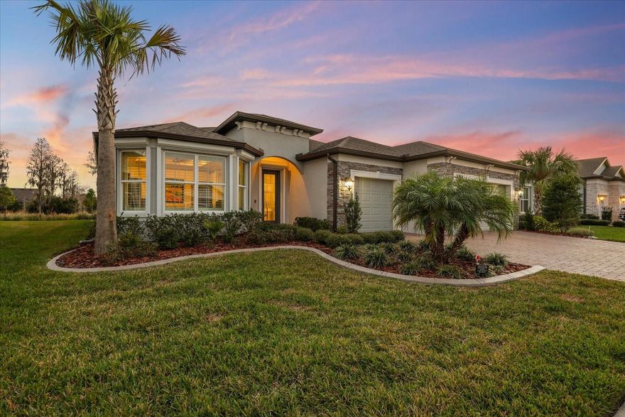 Live the Florida lifestyle in this exceptional Echelon Series home located in the highly sought-after gated Del Webb 55+ community in Land O’ Lakes. Designed for active adult living, this move-in-ready home offers luxury, connection, and resort-style amenities where neighbors become friends and every day brings the option to relax or stay socially engaged.
Del Webb Land O’ Lakes features a 19,000+ sq. ft. clubhouse, resort-style pools, a state-of-the-art fitness center with classes, pickleball and tennis courts, a community garden, dog park, over 40 resident clubs and a full calendar of events coordinated by a dedicated Lifestyle Director—creating a true active adult lifestyle community.
This beautifully upgraded home offers 2 bedrooms, 2.5 bathrooms, and a den with French doors, offering flexibility for a home office, third bedroom, or private retreat. The open-concept floor plan showcases coffered ceilings, 8-foot doors, custom millwork, crown molding, and designer finishes throughout.
The entertainer-inspired kitchen features an oversized quartz island, upgraded appliances, soft-close cabinetry with pullouts, walk-in pantry, and a separate bar area with wine refrigerator—perfect for everyday living and effortless entertaining. The great room flows seamlessly to the outdoors through expansive pocketing sliding glass doors, creating ideal indoor-outdoor living.
Step outside to the private lanai and enjoy true Florida living with a heated custom pool featuring a sun shelf, salt system, travertine pavers, cage lighting, and convenient retractable hurricane-ready screen. Overlooking an oversized conservation lot, this peaceful outdoor oasis is perfect for morning coffee, sunset cocktails, or quiet evenings.
The luxurious primary suite includes plantation shutters, coffered ceilings, dual vanities, an oversized zero-entry walk-in shower, and a custom-designed walk-in closet, all complemented by serene conservation views that enhance the sense of retreat. Guests will appreciate the private ensuite bedroom featuring an expansive bathroom with walk-in shower and closet, also overlooking conservation views for added privacy and comfort. The massive laundry room is thoughtfully designed with custom built-in cabinetry on both sides, offering exceptional storage, workspace, and organization—making everyday tasks both efficient and elegant.
Additional upgrades include a whole-home water softener, tankless water heater, gutters, landscape curbing, and the ease and convenience of installed roll-down hurricane shutters for peace of mind. The extended-depth three-car garage with custom epoxy flooring provides exceptional space for large vehicles, a golf cart, workshop space, or extra storage. HOA Fees include yard maintenance, plus internet and cable.
Conveniently located near shopping, dining, golf, medical facilities, Tampa International Airport, and Florida’s beaches. Meticulously maintained and extensively upgraded, this move-in-ready Del Webb home reflects exceptional pride of ownership and thoughtful enhancements throughout, you only need to unpack and relax.
Del Webb isn’t just a community—it’s a lifestyle. Your next chapter begins here.