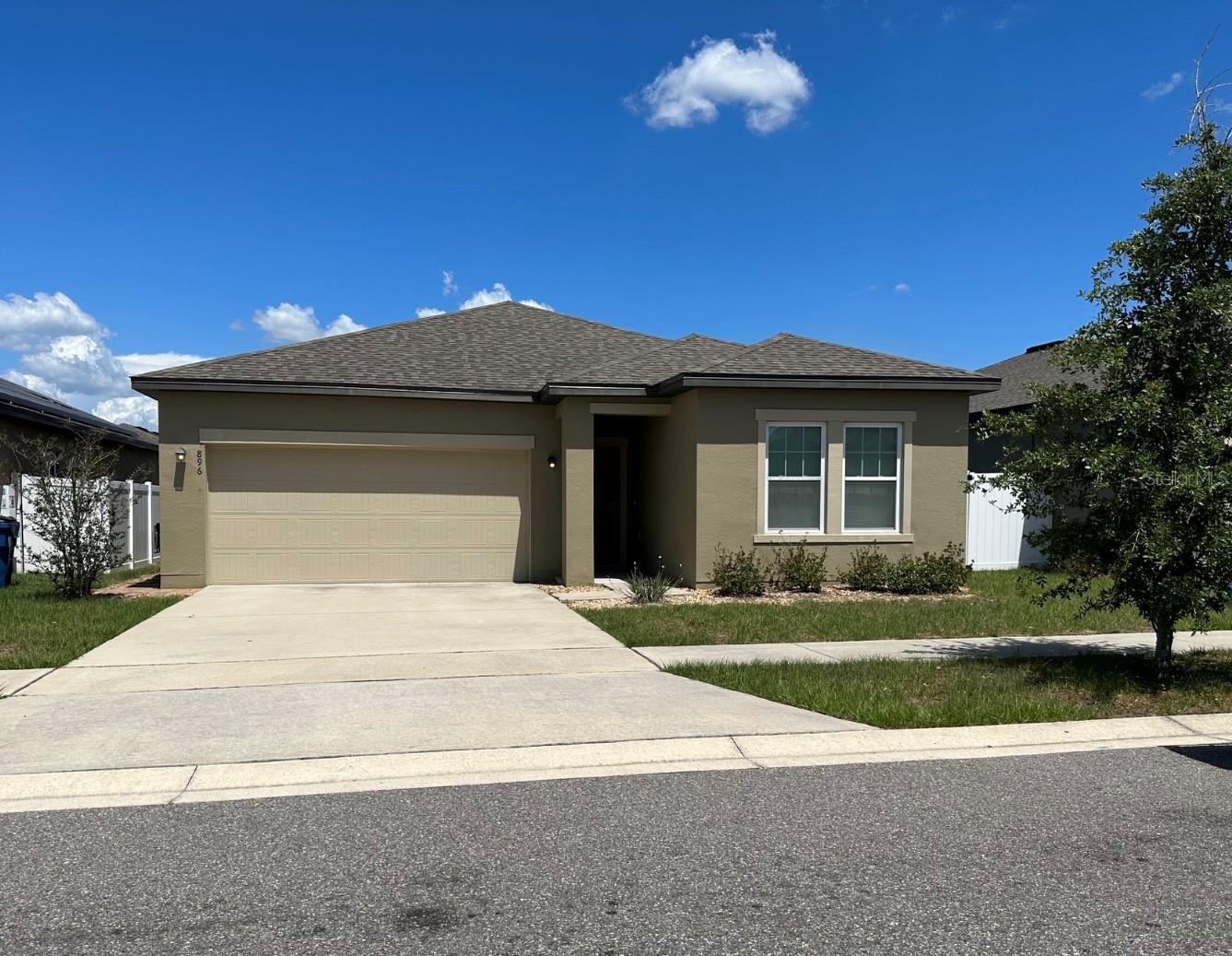 Come see this beautiful 3 bedroom 2 bathroom house with private back yard located in the Orchid Grove community in Davenport, FL. Escape the apartment and townhouse confinement with this lovely home featuring a roomy open split floor plan, upgraded kitchen, covered lanai, and back yard with privacy fence. As you enter the home there are two bedrooms on the right separated by a full Jack & Jill bathroom. The second bedroom has a ceiling fan and walk- in-closet. Continue through the home to find the large open living room, kitchen, and dining room. The kitchen features stainless steel appliances, granite counter tops, a large island with sink, and walk in pantry. From the dining room you have easy access to the cover lanai. On the opposite side of the home is the main bedroom with a ceiling fan and ensuite bathroom with a large walk-in-closet. Towards the front of the home is the laundry room with washer and dryer. The large 2 car garage has an automatic garage door opener and shelving for storage.
The community amenities include an amazing pool to enjoy the beautiful Florida weather and a fenced in playground. Such a great location as well. Far enough from the hustle and bustle for comfort, but just minutes away from restaurants, shopping at Posner Park, grocery stores, Walmart, Lowes, near by hospital and schools as well. Theme parks are also accessible being located between Disney and Legoland. See for yourself!