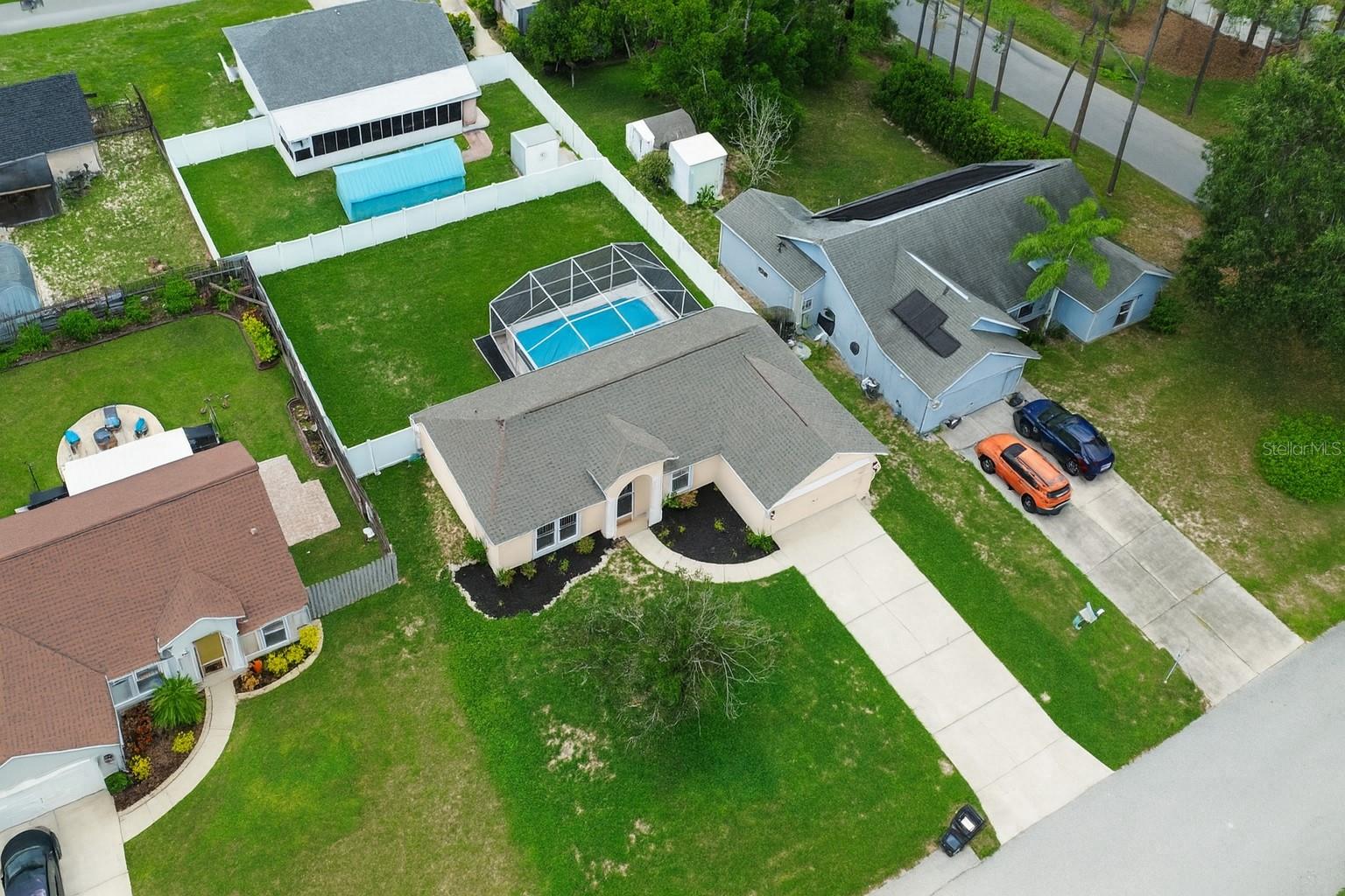 **HUGE BACKYARD! Ideal for pets, family gatherings and Sunday BBQs** This 1,289 sq. ft. home with 3-bedrooms & 2-bathrooms is designed for both comfort and lifestyle. The property features a huge fully fenced backyard with a privacy fence, offering the perfect setting for pets, outdoor activities, and family gatherings. A sparkling pool serves as the centerpiece of the backyard oasis, providing the ideal spot to relax and enjoy the Florida sunshine in complete seclusion. Inside, the home offers a bright and functional layout with generous living spaces, well-sized bedrooms, and an easy flow that suits both everyday living and entertaining. Whether you’re looking for a private retreat, a pet-friendly home, or the perfect place to host guests, this move-in ready property delivers the perfect combination of indoor charm and outdoor enjoyment.