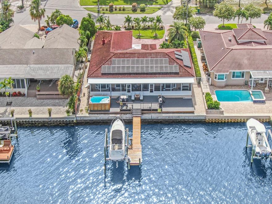 OPEN WIDE WATERFRONT ON BOCA CIEGA BAY.......This Sailboat intercostal waterfront home has oversized swim spa and a beautiful deck on water which feels you are on a boat looking at the open water and viewing the panoramic sunset. This fabulous updated home is a solar home with generator. Front of the house has magnificent patio for your morning pleasure to have coffee and enjoy the sunrise. This home has 3bed, 2 bath, and a bonus room, and 2 car garage and new boat lift and dock. Pasadena Golf and country club golf course is only few minutes away from property; also St.Pete Beach and fine dining and entertainment is only minutes away from the property. Owner financing is available. Please call for your private tour