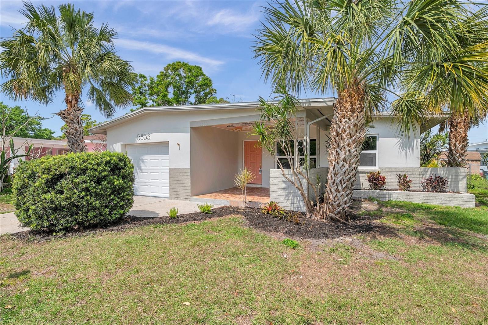 Welcome to your St. Petersburg retreat! This beautifully updated 3-bedroom, 2-bath block home with a 1-car garage combines modern style with peace-of-mind upgrades. Enjoy comfort year-round with a brand-new HVAC system (2024), energy-efficient impact windows, and a 2020 roof already in place. Step inside to an open-concept layout flooded with natural light, where every detail has been thoughtfully designed. The living area flows seamlessly into a stunning kitchen featuring quartz countertops, sleek cabinetry, and stainless steel appliances—perfect for both everyday living and entertaining. The private primary suite creates a calming escape with its own en-suite bath, while two additional bedrooms offer flexibility for guests, a home office, or a growing household. Outside, the spacious backyard is a blank canvas for your Florida lifestyle—imagine weekend barbecues, a vibrant garden, or a cozy firepit under the stars. All this, just minutes from shopping, dining, lively downtown St. Pete, and the world-famous Gulf beaches. This home checks every box—don’t miss your chance to make it yours!