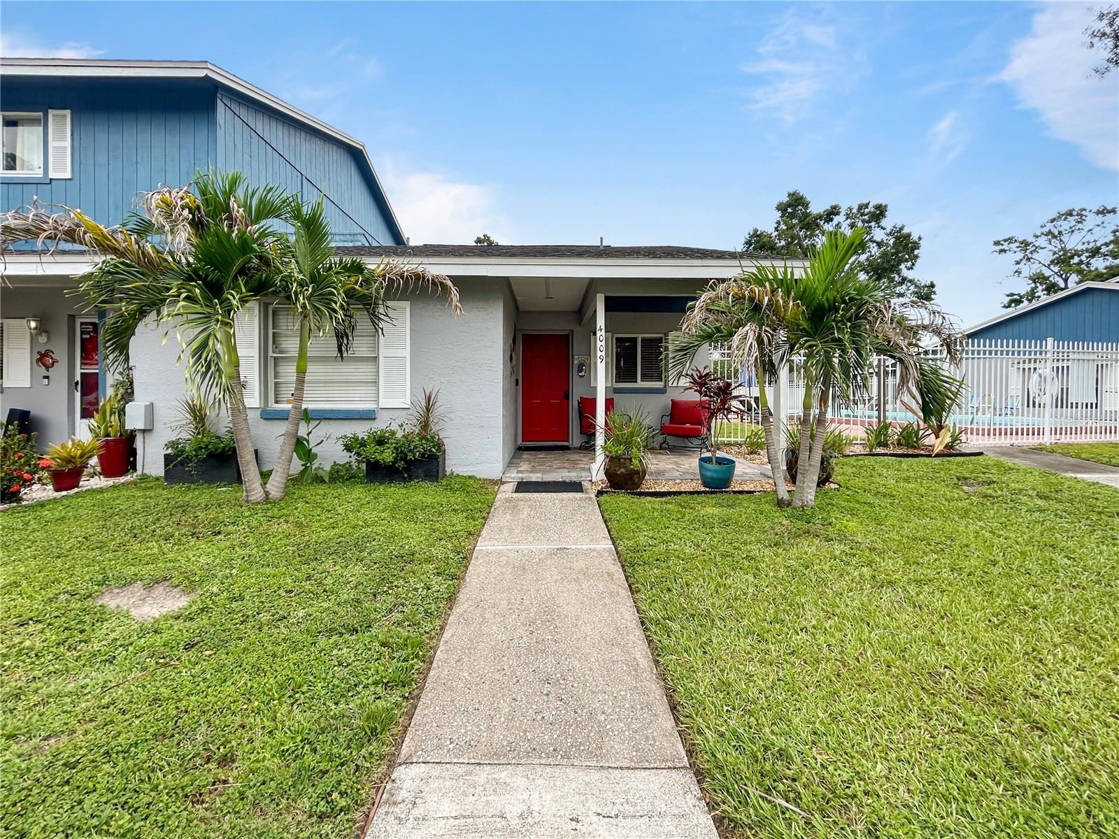This hidden gem is close to shopping, restaurants, Bucs Stadium, Rays/Yankees Stadium and Tampa International Airport. Close to all of that yet tucked away in a quaint well-cared for community that includes an awesome pool and a scenic pond. Units here do not come available very often! This 2-bedroom/2 full bathroom unit has voluptuous high ceilings throughout. The open floor plan encompasses the kitchen, dining and living areas so you can keep the conversations going! The porcelain tile flooring is hardy and appealing. The kitchen has nice stainless-steel appliances and a solid island with drawers. This island is easily moved if you desire it elsewhere. The living room is spacious and comfortable. The split-bedroom arrangement provides privacy. The primary bedroom has an ensuite bathroom with shower and a large vanity. Bedroom 2 is roomy with a nice sized closet. Bathroom 2 is accessed from the living area and includes a tub/shower. Lots of windows allow natural sunlight to fill the rooms. Speaking of natural light, you have two lovely porches to relax on. There is a front porch with pavers and a delightful large, screened porch out back to unwind. And to top it all off, take a refreshing dip in the pool!! Everything is single-story so there are no stairs to worry about. You get all of this in one of the most AFFORDABLE priced condos in the area! PLUS one of the LOWEST HOA/condo FEES in the area at just $395!!! And that fee, as low as it is, includes water, trash, lawn maintenance, master insurance policy, POOL and pool maintenance! Come on by and see for yourself this fabulous opportunity!