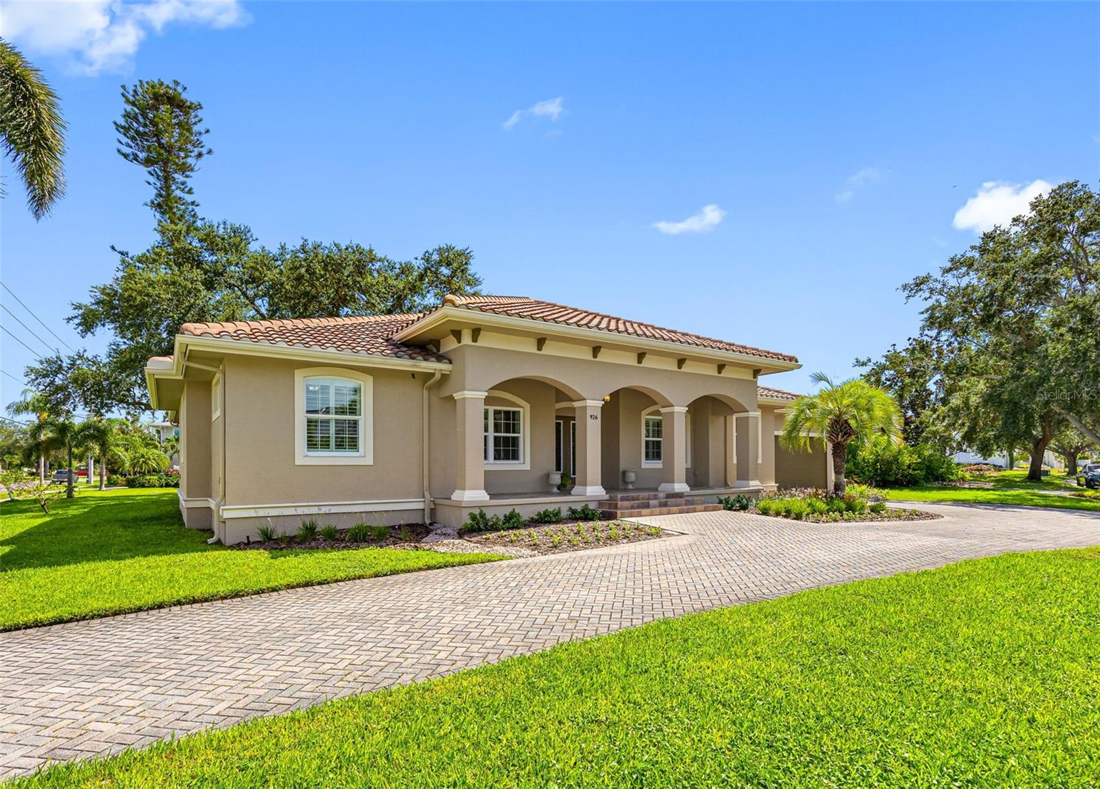 In the heart of one of St. Petersburg’s most treasured neighborhoods—Eden Shores on Snell Isle—sits a block home with a story, one built not just with concrete and wood, but with care, intention, and the enduring love of a father for his family. This home wasn’t just constructed—it was crafted. Every block was placed with purpose, every detail designed to withstand time, storms, and generations of memories. Built high and dry, it has proven its resilience. Even during Hurricane Helene, when nearby homes were tested, this one stood strong. Only the garage experienced minor water—while the main living spaces remained untouched and full of light. And oh, the light. Soaring ceilings flood every corner with sunshine. Rooms feel open and airy, inviting laughter to bounce off the walls and life to unfold freely. Whether it’s morning coffee in the kitchen, family dinners in the dining room, or a quiet moment in the backyard, this home was made to hold moments that matter. With a brand-new refrigerator, range, and dishwasher, hurricane impact windows, plus an HVAC system just two years old, the bones of the home are strong. The oversized, extra-deep two-car garage—with its impressive 11-foot ceiling—is ideal for more than just vehicles. It easily accommodates a golf cart, a workbench, or even a creative studio or hobby space. A special feature sets this home apart: the attached mother-in-law suite. It’s tucked just beyond a discreet pocket door and has its own exterior access—offering privacy and independence for a guest, caregiver, or multigenerational family member who wants to come and go with ease. The backyard is a true gem—generously sized and brimming with possibility. Whether you're dreaming of a custom pool, a lush garden, or weekend barbecues under the stars, this space is ready to bring those dreams to life. Downtown St. Petersburg is just moments away. World-class dining, local boutiques, art walks, and the serene green expanse of Vinoy Park along the waterfront await. You can go from the peaceful rhythm of home to the vibrant pulse of the city in minutes. This is more than just a house. It’s a legacy—built with heart, shaped by years of love, and ready for its next chapter.