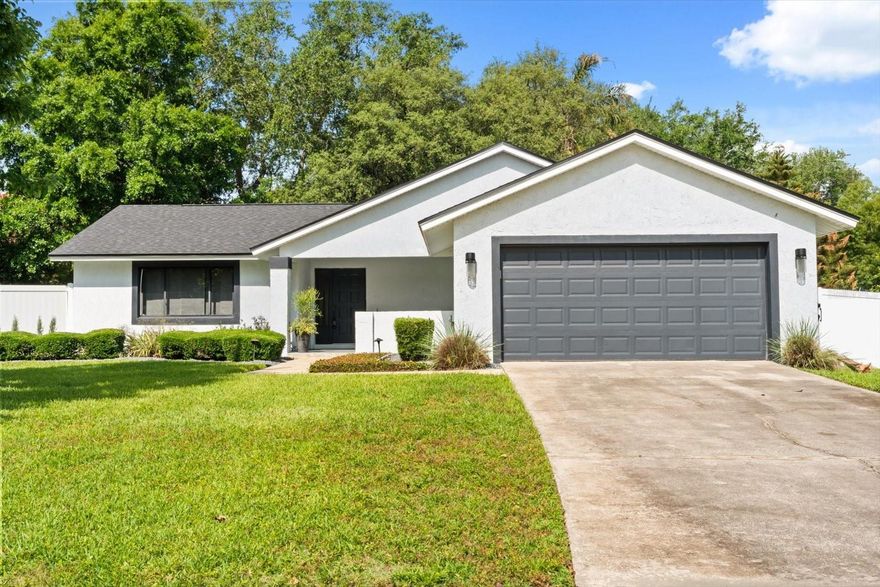 Settle into life at 9017 Esguerra Ct, a beautifully updated single-story home in Bay Lakes at Granada with a clean, modern feel, abundant natural light, and a functional layout that makes everyday living feel easy. Remodeled in 2022, the home features light wood-look flooring, updated baseboards, recessed lighting, fresh neutral finishes, and stylish accent walls that create a warm, move-in ready backdrop for your furniture, your routines, and your personal style. The kitchen offers white 42-inch upper cabinetry, quartz counters, coordinating GE Café appliances, a closet pantry, a sleek tile backsplash, and a bright window over the sink, giving you a polished and practical space for weeknight dinners, morning coffee, and casual entertaining. In addition to the living room, the home offers a formal dining room and a spacious sunken family room, creating comfortable flexibility for gathering, hosting, or relaxing. The owner’s suite is positioned at the rear of the home and includes two closets, including one walk-in, along with an en suite bathroom featuring dual sinks, marble flooring, and a curbless walk-in shower. Step outside through the French doors to an oversized fenced cul-de-sac lot with a large patio area, mature landscaping, irrigation, stepping-stone pathways, and space to relax, entertain, or garden. Major systems, including the roof, A/C, tankless water heater, and electrical panel, were updated in 2022. Located in the established Bay Lakes at Granada community in Dr. Phillips, this home offers a highly convenient Southwest Orlando setting near Sand Lake Road, Restaurant Row, everyday shopping, dining, major roadways, Universal Orlando, Walt Disney World, and the International Drive attractions corridor. Schedule your private showing and see how easily this home could fit your next chapter.