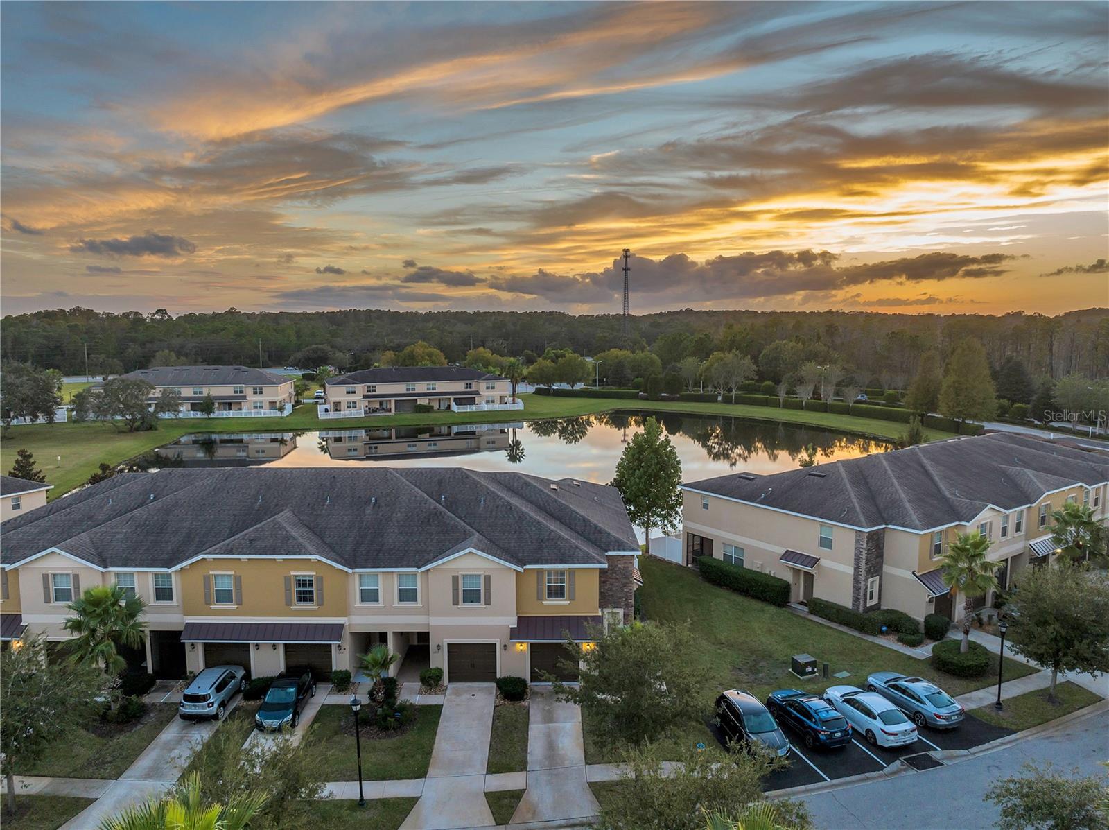 UPDATED Charming Townhome with a WATERVIEW. 3 bedrooms, 2.5 bathrooms, a spacious loft, and a ONE-CAR GARAGE. Just a few short minutes the Suncoast Parkway (Veterans Expressway). Approx. 37-minutes to Tampa International Airport. Fenced in 280 sq. ft. PAVED LANAI. DOWNSTAIRS: open living/dining, built-in desk, coat closet, half bath, and large under-stair storage. UPSTAIRS: all bedrooms, oversized loft, laundry (WASHER & DRYER INCLUDED), and a spacious master suite with DOUBLE DOOR ENTRY, WALK-IN CLOSET, and water view. The Jack-n-Jill bathroom connects two generous guest rooms. UPDATES: 2022 -Full interior paint (including doors/closets), luxury laminate and plank tile flooring, ceiling fans in every room w/ remotes, 70” mounted TV in the living room, TVs in (2) bedrooms, upgraded lighting w/ dimmers, ceiling fans in every room with remotes, soft-close cabinets, remodeled master bath with WATERFALL SHOWER, granite bench & inlay, shoe cabinet in guest room, WHOLE HOME WATER SOFTENER (2025), keyless entry. Maintenance-free living includes water, sewer, trash, & exterior lawn care. Amenities include a COMMUNITY POOL, GYM & CLUBHOUSE. Publix shopping center and amenities minutes from your door. Bike to the Suncoast bike trail or spend a day at the Sunwest Water Park right at your fingertips. There’s something for everyone—marinas, golf courses, Hudson Beach on the Gulf of Mexico with cozy restaurants and daily sunset views, and downtown New Port Richey centered around the Pithlachascotee River, perfect for launching kayaks and paddleboards. Located in a non-flood required zone. HURRICANE SHUTTERS included. Rental can come Furnished OR Unfurnished.