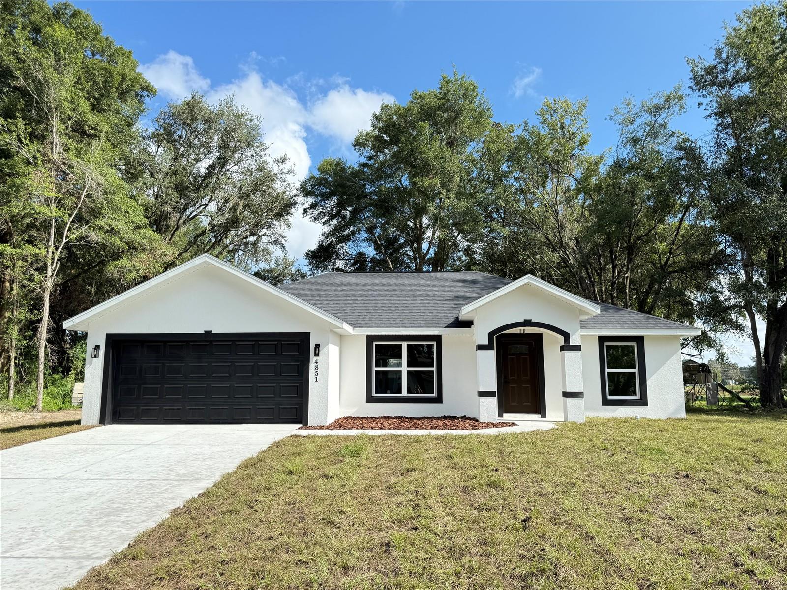 Stunning New Construction 3/2 with Premium Finishes!
This brand new 3 bedroom, 2 bath home offers modern living in a quiet neighborhood on a high and dry lot. Featuring elegant quartz countertops, beautifully tiled showers, and an open, functional layout. Conveniently located with easy access to Ocala, Belleview, and The Villages. A perfect blend of peaceful living and central location—ideal for families, retirees, or first-time buyers!