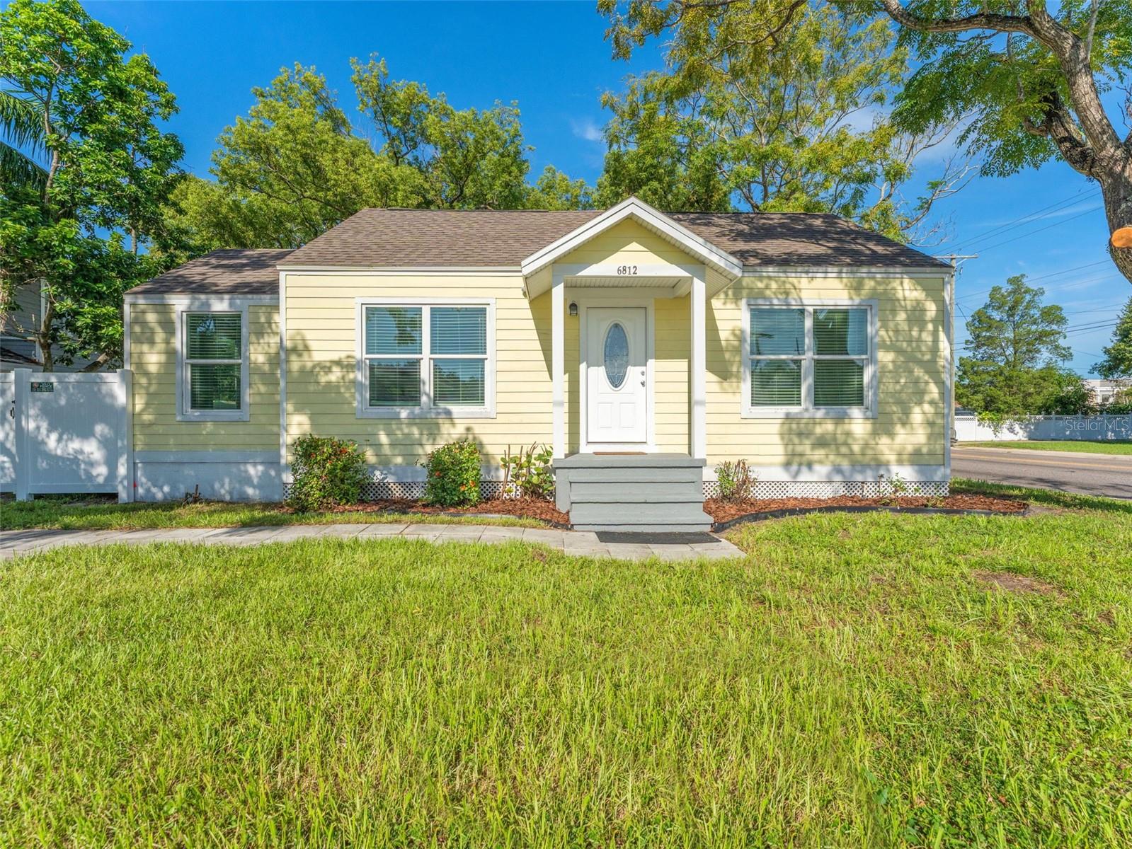 One or more photo(s) has been virtually staged. Turn key 3-bedroom, 2-bathroom home has been fully updated with modern upgrades while maintaining the charm of its desirable Old Seminole Heights location—just minutes from Downtown Tampa, ZooTampa, Busch Gardens, Tampa International Airport, and more! Major updates include: new roof (2022), hurricane impact windows (2022), updated wiring (2021), new plumbing lines (2021), AC handler and ductwork (2020), new drywall and insulation (2022), exterior siding (2021), and brand-new vinyl fencing (2025).Inside you’ll love the luxury vinyl plank floors, fresh paint, modern kitchen with granite countertops & stainless appliances, and updated baths with dual granite vanities. The primary suite features its own en suite bathroom. Enjoy a large fenced yard, perfect for entertaining, pets, or relaxing evenings outdoors. A detached insulated shed (2019) offers the perfect space for a workshop, gym, or studio. This move-in-ready home offers peace of mind with extensive upgrades and a central location close to shopping, dining, and major Tampa attractions, all with no HOA or flood zone.
