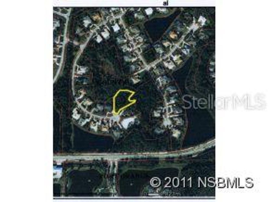 One of the last LARGE lots located in the Four Season section of the Spruce Creek Fly-In community...This lot could potentially have a building footprint of over 10,000 sq. ft...This lot borders a conservation area and is an area of newer homes with side entry garages. The Spruce Creek Fly-In community offers 24 hour manned and gated security, a 4,000 foot runway, parks and a children rec. area... There are memberships availabel in the Country Club.; Cleared: No ;Water: Available at Site