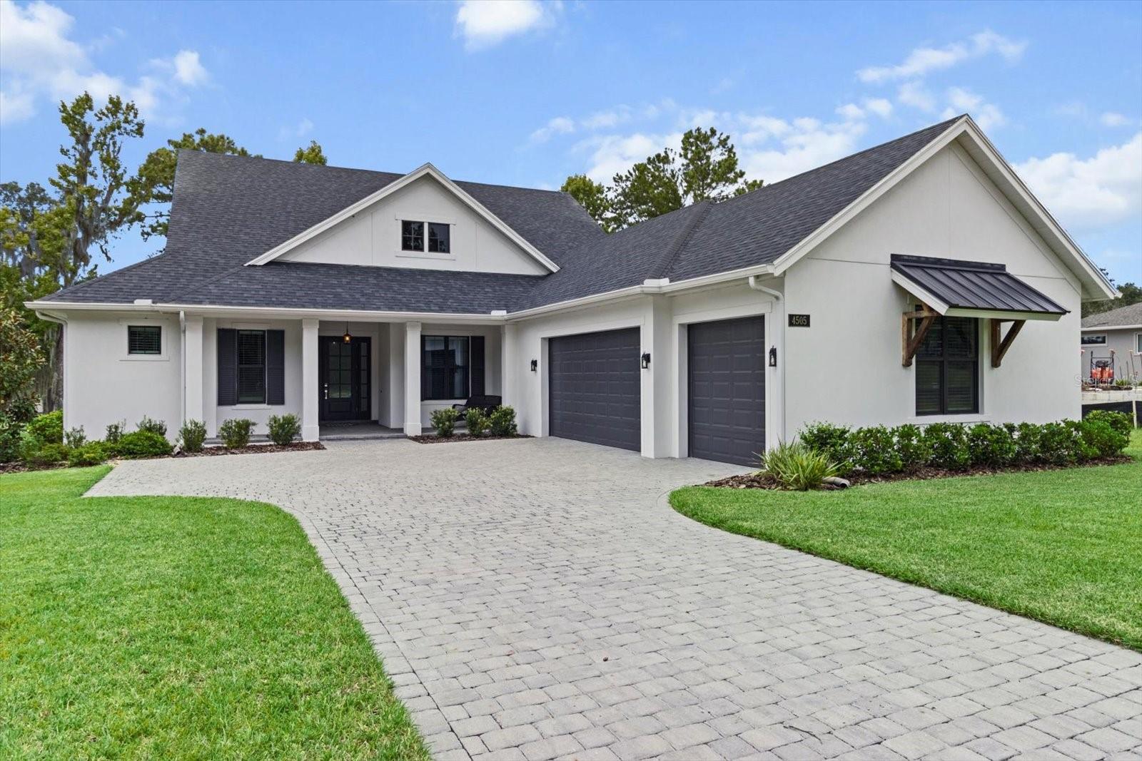 Welcome to your better than new Golf Course Retreat home in Southern Hills Plantation Club. Why wait to build when you can move into this nearly new, 4-bedroom, 3 bathroom custom home with a gorgeous golf course view of the private Pete Dye-designed golf course? This 2-year old home offers over $20,000 in thoughtful enhancements you won't find in comparable new construction, including: Full gutter system, whole home water softener, custom cabinetry in the laundry room, hideaway trash and recycling bins built into the oversized kitchen island, lighted ceiling fans in every room with remote (including outdoor lanai area), designer blown glass light fixtures throughout, electrical outlet conveniently placed inside the spacious master closet and custom-cut blinds on all windows for a polished, move-in ready look. Inside, enjoy the same high-end features and finishes as the new builds: gourmet kitchen with quartz countertops, oversized pantry, and a smart, split floor plan with a private guest ensuite, ideal for out of town guests. Nestled within the beauty of Southern Hills Plantation Club, this home comes with access to resort-style amenities: Championship golf, spa and fitness center, resort style pool and poolside café, tennis and pickle ball courts and year round social events for members. Located just 45 minutes north of Tampa with easy access to the Veteran's Expressway and I-275, this home delivers luxury, lifestyle and location! Better than new - with priceless views and custom upgrades already in place. Come and see the difference!