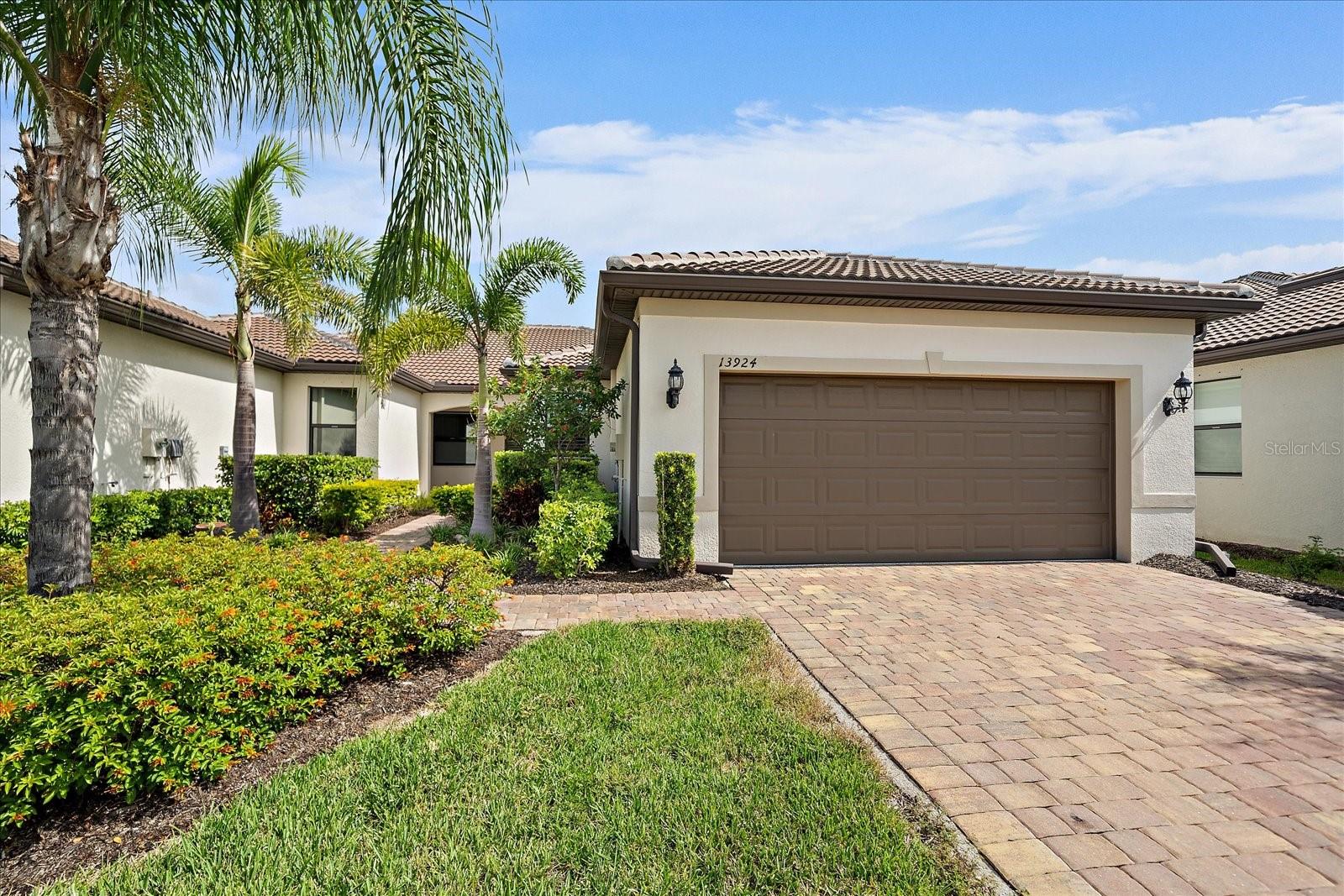 Welcome to this beautifully designed villa home offering 2 bedrooms, 2 bathrooms, and a versatile den. With 10-foot ceilings and 8-foot doors throughout, the interior feels open and inviting. Plantation shutters accent the hurricane-impact windows, adding both style and functionality, while additional hurricane shutters provide peace of mind. A 2021 roof, HVAC & water heater and 2021 appliances ensure lasting value and reliability. Offered fully furnished, this residence is move-in ready for its next owner. From the screened-in lanai, enjoy unobstructed views of the water with the option to extend the lanai for even more outdoor living space. The home is ideally situated on a quiet cul-de-sac and features an oversized, extended paver driveway along with an epoxied garage floor. As part of a maintenance-free community, exterior upkeep is handled for you, allowing more time to enjoy the IslandWalk lifestyle. IslandWalk is a gated, resort-style community that offers an extensive array of amenities designed for both relaxation and recreation. Residents enjoy access to two resort pools and spas, a dedicated lap pool, and a clubhouse with multipurpose rooms, a lanai, pavilion, and catering kitchen for social gatherings. The fitness centers and movement rooms support an active lifestyle, while the library, game room with billiards and ping-pong, and arts and crafts studio provide space for creativity and leisure. Outdoor amenities include Har-Tru tennis courts, 12 pickleball courts, bocce courts, basketball, a playground, fire pits, grills, a community garden, and a dog park with separate sections for large and small pets. Scenic walking trails, a boardwalk, and lush landscaped areas create a serene backdrop for daily living.All of this is just minutes from Wellen Park’s shopping, dining, and entertainment, area beaches, and the Atlanta Braves’ spring training stadium. This villa blends modern comfort, water views, and a vibrant, amenity-rich lifestyle in one of Venice’s most sought-after communities.
