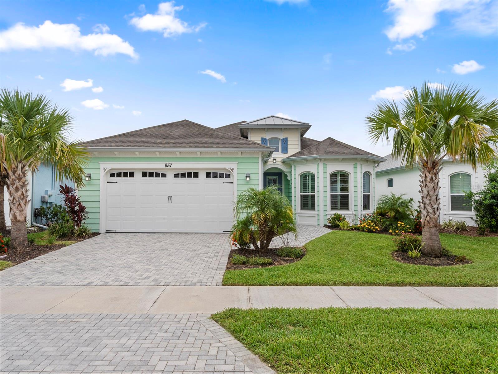 Knock knock...this is it! One of a kind Breeze Bay Premium Waterfront Home. This 3 Bed 3 Bath Home has custom updates at every turn. The Bathrooms and Gourmet Kitchen have Custom Cabinets with Quartz and Granite. 2 Guest Bedrroms, one with an en-suite Full Bath. Open Floor Plan that Highlights the stunning Gourmet Kitchen that also features a 48'' Kucht Professional Double Oven with 8 Burners and Cooking Griddle. Oodles of Cabinet Storage in the Cabinets and Island, even a Book Case for your Cookbooks! Primary Bedroom with Bay Windows, Double Walk In Closets and Gorgeous Bath with Dual Vanities and Walk in Shower. Living Room has a 4 slider door that opens to the extended Lanai and features the amazing waterfront view. This is the Perfect Home for Gatherings Large and Small! Luxury Vinyl Plank and Tile Throughout. Plantation Shutters. Decorator Interior Paint. Inside Laundry with Cabinets and Folding Shelf. Garage has Epoxy Floors and cabinets for storage and work space. Home is located on the Amenity Side of the Neighborhood!