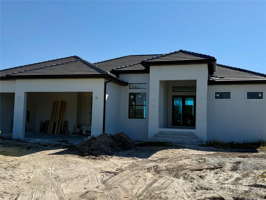 Under Construction. Introducing “The Royal Palm,” BF Homes’ newest luxury plan offering nearly 2,600 sq. ft. of smart, beautifully designed living space. This 4-bedroom, 4-bath home features a bath for every bedroom, a den/study, and a 3-car garage. Located on a sailboat-access canal, it includes a 30' x 4' dock, seawall, and 4-post supports ready for your lift. Enjoy a 21' x 12' pool with hot tub, an oversized sun deck, and a full pool bath with large walk-in shower, plus a 32' x 12' covered lanai with two ceiling fans and an outdoor-kitchen rough-in. Inside, the primary suite offers dual vanities, a large walk-in shower, soaking tub, and excellent storage alongside a kitchen pantry, three walk-in closets, two linen closets, and two double-door closets. The kitchen features an island with sink and breakfast bar, and the den provides a quiet retreat for work or relaxation. Located in the sought-after South Gulf Cove community, this home is close to beaches, golf, dining, and shopping—delivering the ideal Florida waterfront lifestyle.