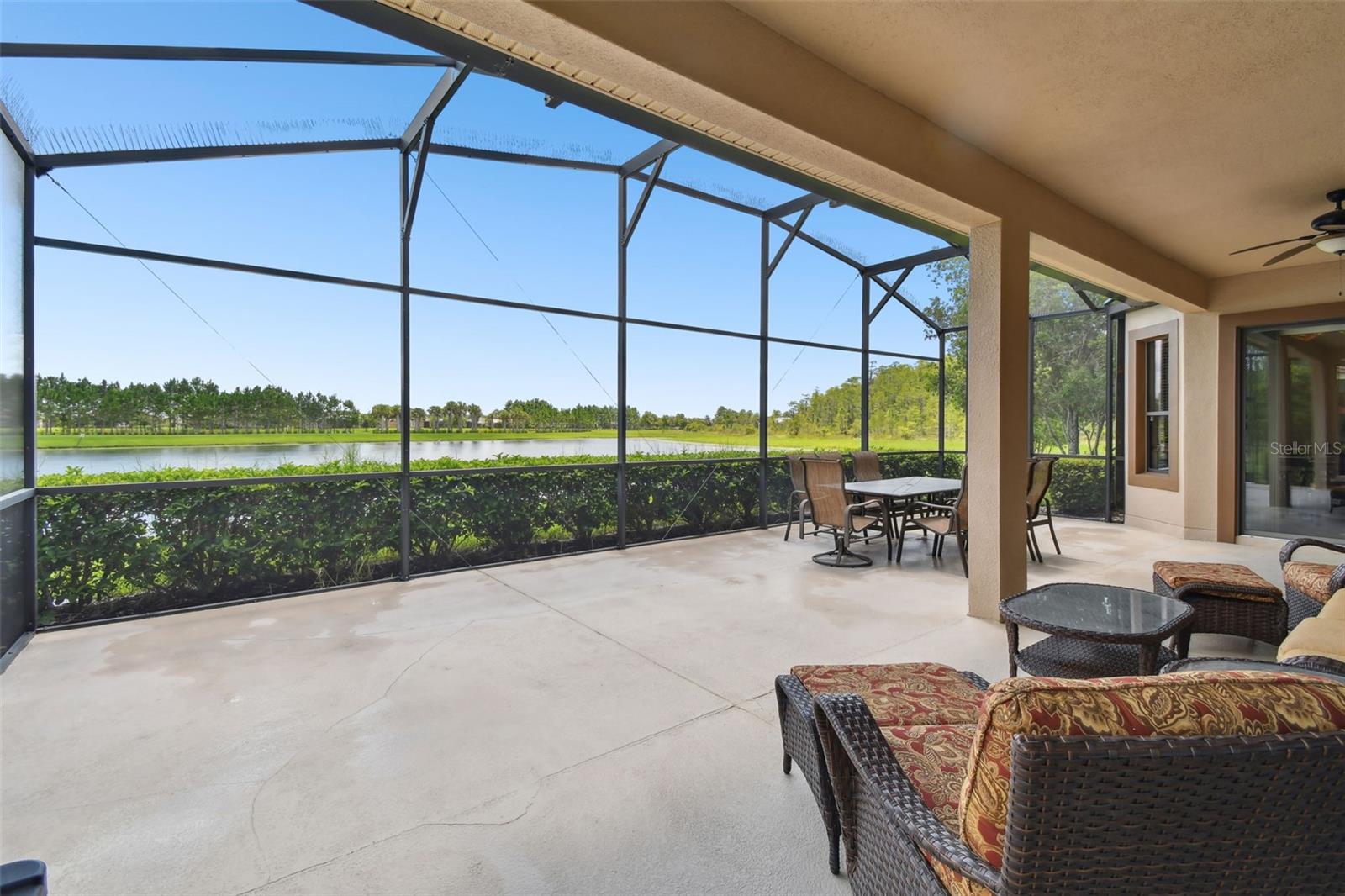 Welcome to a beautifully designed 3-bedroom, 3.5-bath home, PLUS DEN, offering the perfect combination of luxury, comfort, and convenience for 55+ living. Located in the sought-after Portofino neighborhood of Solivita, this home delivers serene water views, a spacious open layout, and low-maintenance living—all in a vibrant, active-adult community. Step inside to an OPEN_CONCEPT floor plan that creates effortless flow for everyday living and entertaining. Each of the three generously sized bedrooms features its own en-suite bath, ensuring privacy for residents and guests. A convenient powder room adds extra functionality for visitors. Curb appeal shines with a TILE ROOF, 3-CAR GARAGE, and an extra-wide driveway for easy parking and accessibility. Inside, the light-filled great room offers sweeping water views and opens seamlessly to the outdoor living space for a true indoor-outdoor experience. The GOURMET KITCHEN is a showstopper—featuring stainless steel appliances, double ovens, a large eat-in island, and an inviting breakfast nook overlooking the water. Whether you’re hosting friends or enjoying a quiet morning coffee, this space is designed for both style and function. Relax on the SCREENED LANAI, surrounded by lush landscaping and tranquil WATER VIEWS - a perfect setting for entertaining or unwinding in the Florida sunshine. The expansive backyard offers room for a pool, garden, or fenced pet-friendly space. The primary suite is a private retreat with water views, a tray ceiling, and abundant natural light. Its spa-inspired bathroom boasts dual vanities, a makeup area, soaking tub, and a walk-in shower with frameless glass. Don’t miss this rare opportunity to own a waterfront home in Portofino - where elegance, convenience, and community come together beautifully! All this in one of the top 55+ communities in America. Solivita offers residents access to state of the art amenities and work out facilities, dance and aerobics studios, a business center, 14 heated swimming pools, 2 heated spas, tennis courts, pickleball courts, shuffleboard, bocce ball, billiards room, art gallery, 3 restaurants and 2 championship 18-hole golf courses, driving range and putting course. Every day offers something new to explore and enjoy! This home also features easy access to nearby shops, dining, and health care, offering the perfect balance of privacy and lifestyle. Don't miss out on the opportunity to have a first class lifestyle.