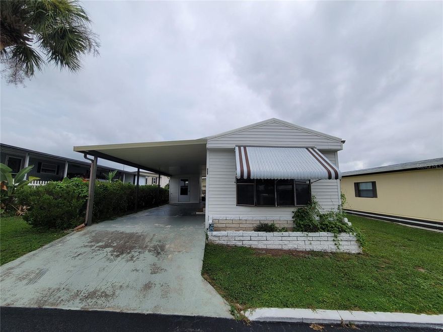 Motivated seller! Welcome to Spanish Trails Village, an active 55+ community in the heart of Zephyrhills, where you OWN the land with a low monthly HOA fee of just $114. This charming 2-bedroom, 1-bath home features luxury vinyl flooring throughout, offering both style and durability. For added peace of mind, the roof was replaced in 2021, providing long-term value and protection.

Enjoy a spacious kitchen with a breakfast bar and a beautiful wide window that fills the space with natural light.

Outside, you’ll find a covered carport for shaded parking and a separate storage shed—perfect for tools, outdoor gear, and more. The washer and dryer are conveniently located inside the storage shed, keeping your laundry area accessible yet out of the way.

As an added bonus, the home includes a golf cart—just add a new battery and you’re ready to cruise the community in style and convenience!

The home is located in a quiet, well-maintained community offering a clubhouse, pool, shuffleboard courts, and more for your enjoyment.

Spanish Trails Village is conveniently located directly across from AdventHealth Hospital and just minutes from shopping, dining, and a short drive to some of Florida’s beautiful beaches.

Schedule your appointment today!