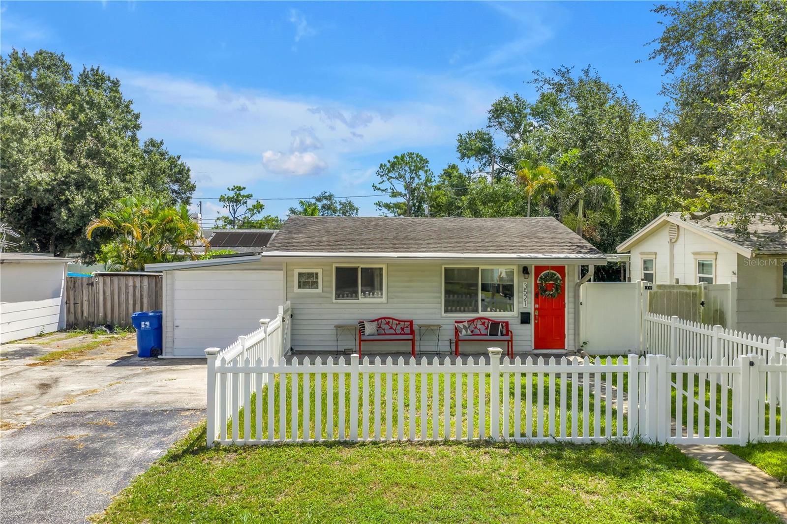 One or more photo(s) has been virtually staged. This home checks all the boxes! The classic “white picket fence” dream can be yours in the heart of mid-St. Petersburg. Situated in a Non-Flood/Non Evacuation Zone with a spacious backyard, this 2-bedroom, 1.5-bath charmer also features a bonus room with gleaming epoxy floors—perfect as a home gym, she-shed, man cave, office…(bonus room not included in the square footage). Enjoy the covered patio out back for relaxing evenings... A great spot to entertain friends and pets alike. You even have an outdoor shower to rinse off after yard work or wash your furry pet without having to step inside the house. Fall in love with the vibrant kitchen that brings warmth and personality to the home. The Samsung appliances and red cabinets steal the show! The baths are updated and stylish, with the half bath as the ensuite in the Primary Bedroom. Even better—this property is getting a BRAND-NEW ROOF and solar panels WILL be placed back on in just a few weeks, offering peace of mind and efficiency for years to come. If you’ve been searching for the right home, now’s the time to step forward. This one is COMPETITIVELY PRICED and ready to Welcome You Home. Close to The Night Life of Downtown St. Petersburg (5 miles), Only 8 miles from the Sugar Sands of the Gulf Beaches, and a short drive to the Eclectic town of Gulfport. The location is hard to beat! Add this home to your "Must See List!"