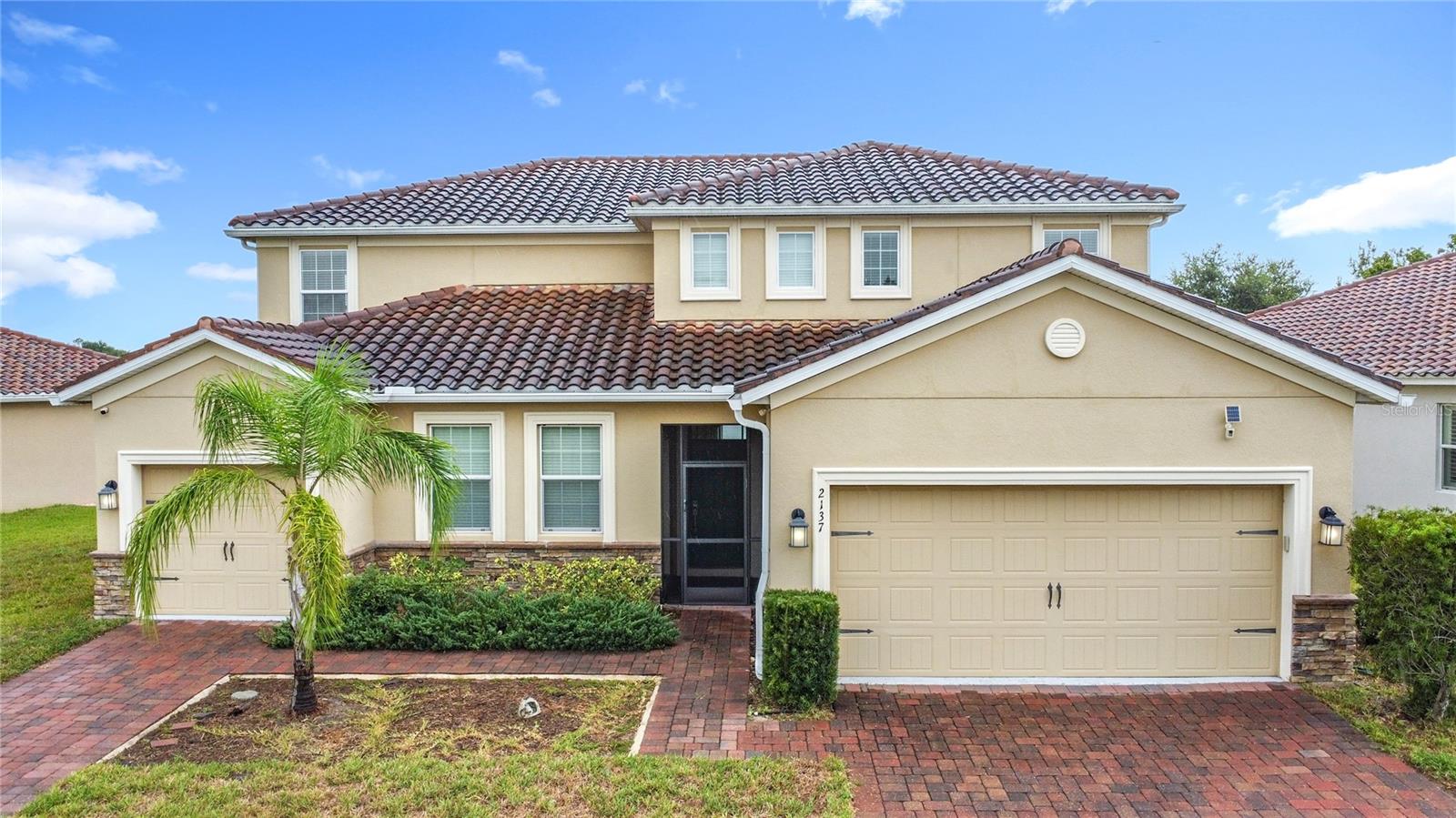 Spacious Multi-Generational Living with PRIVATE IN-LAW SUITE & Saltwater POOL/SPA in Providence! Welcome to this stunning 6-bedroom, 4.5-bathroom home located in the highly sought-after gated golf community of Providence in Davenport, FL. Thoughtfully designed for multi-generational living, this home features a private 1-bedroom, 1-bathroom in-law suite on the first floor—complete with its own kitchen, living space, and a separate 1-car garage. The main residence boasts 4 bedrooms and 3.5 bathrooms, a 2-car garage, and a modern, open-concept layout perfect for everyday living and entertaining. The chef’s kitchen includes quartz countertops, stainless steel appliances, a spacious pantry, solid wood cabinetry, tile backsplash, and a large island. A convenient half bath is located downstairs. Upstairs, the primary suite features a spa-like en suite bathroom with a double sink vanity, garden tub, walk-in shower, and a custom walk-in closet with built-ins. You’ll also find a versatile loft area, plus three additional bedrooms and two full bathrooms. Step outside to your private screened lanai with a saltwater pool and spa, overlooking a peaceful pond view—a true backyard retreat. Located in Providence, one of Davenport’s premier resort-style communities, residents enjoy access to two pools, a state-of-the-art fitness center, tennis courts, playground, clubhouse, walking trails, and an 18-hole championship golf course. With 24-hour security and beautiful landscaping throughout, Providence offers the perfect blend of luxury and lifestyle. Schedule your private showing today!