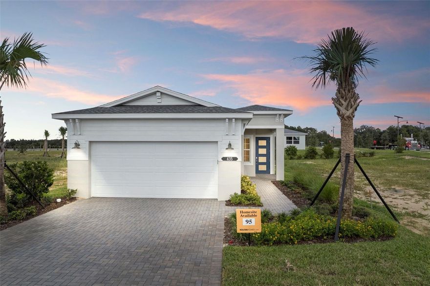 One or more photo(s) has been virtually staged. Cresswind at Hammock Oaks, a new active 55+ community by Kolter Homes, is situated in Lady Lake, FL, famously known as the “home of lakes and sunshine.” Located near The Villages the community is only minutes from Leesburg and convenient to Orlando. This gated community in Central Florida features Cresswind's national award-winning "Set Yourself FREE" lifestyle program based on the cornerstones of Fitness, Relationships, Education and Entertainment. The resident-only clubhouse with a state-of-the-art fitness center and offers 55+ neighbors a place to gather and participate in social activities facilitated by a full-time Lifestyle Director. Outdoor amenities will include pickleball & tennis courts, walking trails, resort-style pool and spa, pool, event and entertainment areas. This Claire floorplan is situated in a premium homesite with no front neighbors. The home includes 3 Bedrooms, Flex/Study, 2 Full Bathrooms and an Open Family/Dining
Room. With an upgraded elevation, this home also has a wide variety of options placed in it such as quartz counter tops, large cabinet crown molding and designer backsplash. Step into a kitchen where sophistication meets functionality. The frameless-style cabinetry creates a sleek, modern aesthetic, beautifully complemented by a decorative cabinet panel wrap on the island that adds a touch of custom luxury. Enjoy exceptional organization with upgraded pot and pan storage drawers, while the designer tambour-dimensional backsplash tile adds visual depth and texture. A stainless steel single-bowl sink pairs perfectly with the luxury quartz countertop, creating a clean and timeless workspace. Additional upgrades include a 24” deep cabinet above the refrigerator with side panel for added storage and a large cabinet crown molding that adds an elegant finishing touch. Every element of this home reflects refined design and modern comfort. A floor outlet in the Great Room enhances convenience and functionality, while the frameless shower enclosure in the Owner’s Bath and tile extending to the ceiling in all bathrooms bring a spa-like feel. Upgraded plumbing fixtures in both baths add a designer touch. The laminate wood plank flooring throughout the Main Living, Flex, and Owner’s Suite areas provides warmth and durability, perfectly complemented by a washable flat interior paint for easy maintenance. Completing the look, a designer glass exterior front door welcomes you home with style and sophistication. Schedule your tour and contact a Cresswind at Hammock Oaks New Home Guide.