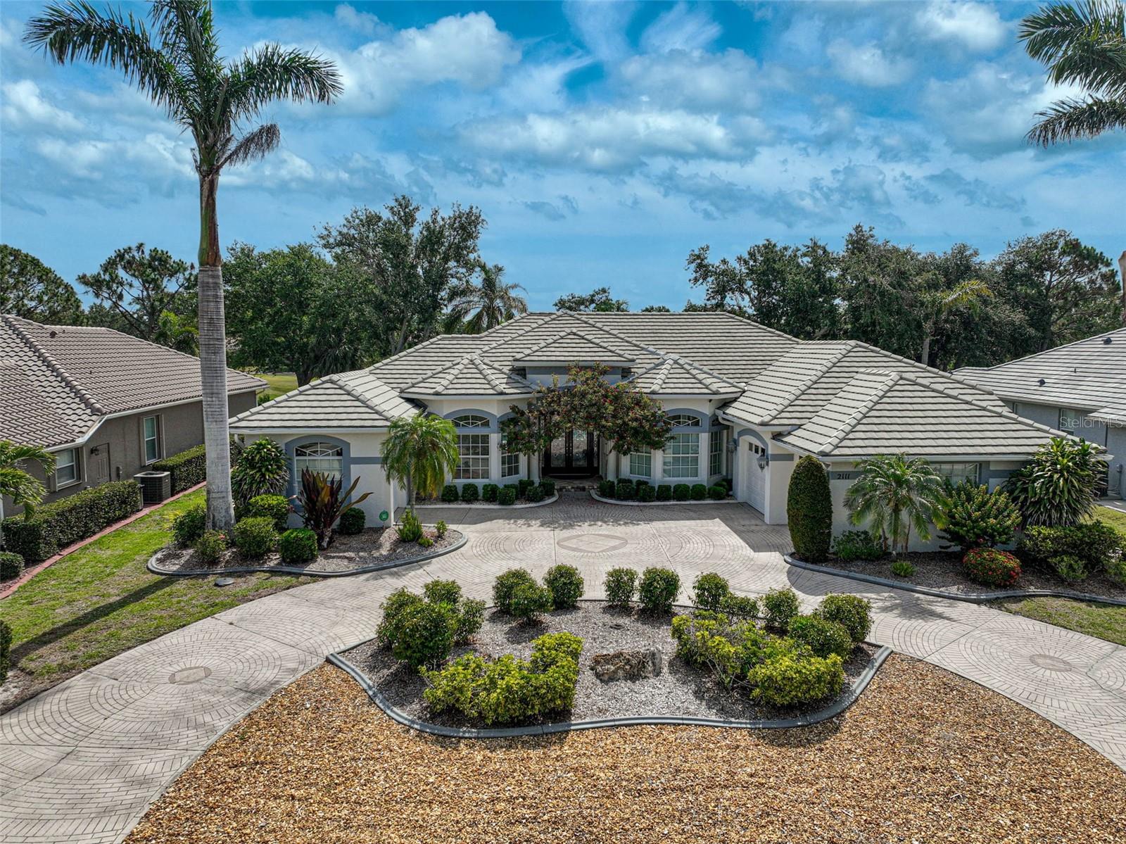 Welcome to your dream home in Calusa Lakes in Nokomis, Florida. This exquisite 2,996 sf residence is ideally located on the 11th fairway of the Calusa Lakes Golf Course, offering a perfect blend of luxury and comfort. With four spacious bedrooms and 3.5 baths, this home is ideal for relaxation and entertaining.
The bright and open floor plan is highlighted by high ceilings and oversized sliders that offer stunning views of the pool and lush golf course. The spacious kitchen, complete with a butler’s pantry, is perfect for culinary endeavors and hosting guests. Modern conveniences such as a central vacuum system enhance the home's efficiency and ease of living.
A circular driveway welcomes you to this elegant property, providing a grand entrance and ample room for guests. The primary suite is a private oasis featuring a Roman shower, while a second primary bedroom with an en-suite bath offers flexibility for in-law accommodations or guests. The three-car garage includes a stall ideally sized for a golf cart or a Mini Cooper.
Enjoy exclusive access to an 18-hole championship golf course and the vibrant community of Calusa Lakes. The location provides close proximity to Nokomis’s pristine beaches, Oscar Scherer State Park, and the diverse shopping, dining, and cultural activities available in Venice and Sarasota.
Experience luxury, convenience, and natural beauty in this remarkable home. Schedule your private tour today and discover a lifestyle that fulfills all your desires.
