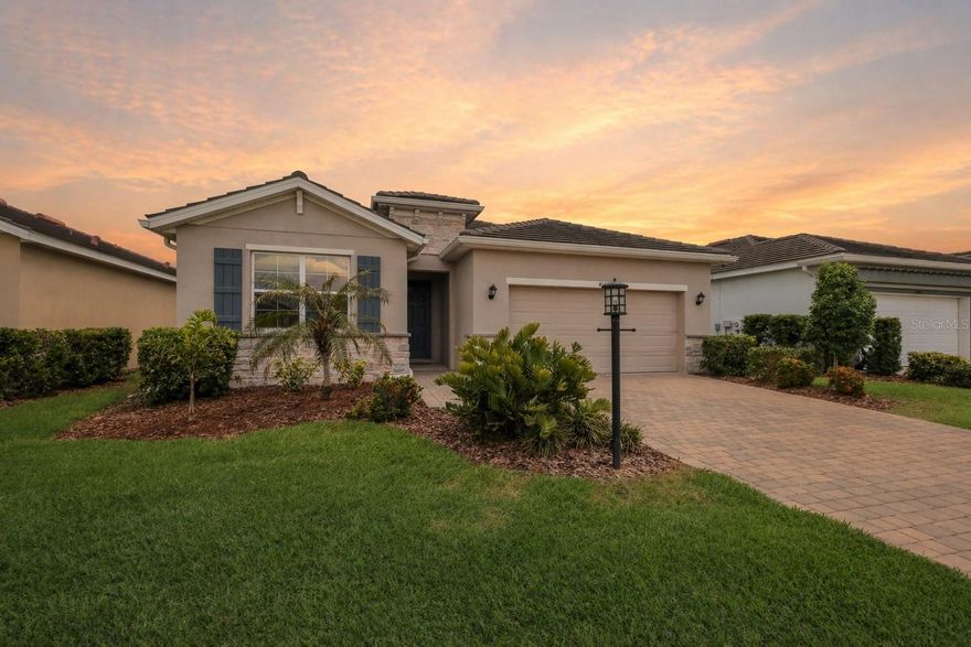 Under contract-accepting backup offers. Welcome to Star Farms at Lakewood Ranch, where elevated living meets everyday comfort in this beautifully customized pool home tucked within a guard-gated community known for its resort-style amenities and scenic surroundings. Built in 2022 and meticulously maintained, this 4 bedroom, 2 bathroom residence offers over 2,000 square feet of thoughtfully designed living space and well over $120,000 in upgrades, giving you the feel of new construction without the wait or added expense of building from scratch. Arriving at the home, you’re welcomed by a clean and well-maintained exterior with manicured landscaping and a paver driveway leading into the spacious garage featuring epoxy floors for both durability and style. Step inside where upgraded interior paint and soft, padded luxury vinyl plank flooring flow seamlessly throughout, setting the tone for a warm yet elevated feel from the moment you walk in. The heart of the home centers around a beautifully upgraded kitchen featuring quartz countertops, upgraded stainless steel appliances, a stylish tile backsplash, and ample cabinetry. The open layout connects effortlessly to the main living and dining spaces, all enhanced by custom blinds and upgraded ceiling fans throughout. The owner’s suite is thoughtfully designed with a fully redesigned closet featuring custom organizers, creating a space that feels both practical and refined. The ensuite bathroom continues the elevated finishes with upgraded quartz countertops, modern sinks, and a walk-in shower enclosed with custom glass doors. Additional bedrooms are well-sized and versatile, while the secondary bathroom mirrors the same level of detail and upgrades. Step outside to your private backyard oasis where the upgrades truly shine. The oversized custom heated saltwater pool and spa serves as the focal point of the outdoor space, surrounded by a screened enclosure and enhanced landscaping for added privacy and ambiance. The fenced backyard adds an extra layer of privacy and provides a secure space for pets or play. This is the kind of outdoor living space that typically comes months after closing with new construction, already completed here for you to enjoy from day one. Living in Star Farms means access to an impressive lineup of amenities including a large clubhouse, resort-style pools, walking and biking trails, and a dog park. This particular section of the community also offers access to its own private clubhouse, dedicated pools, and pickleball courts just blocks from the home, giving you the best of both neighborhood and community-wide amenities. Ideally located in the heart of Lakewood Ranch, known for its tree-lined streets, scenic preserves, and beautifully maintained neighborhoods, this area offers a lifestyle centered around convenience, community, and connection. Just minutes from Waterside Place, you’ll enjoy waterfront dining, boutique shopping, farmers markets, and year-round events. With close proximity to top-rated schools, commuting to Sarasota or Tampa is simple, while the Gulf Coast beaches, including Siesta Key, are a short drive away. With new construction still ongoing in the community, this home presents a rare opportunity to skip the build time, avoid construction delays, and move straight into a like-new home that has already been elevated far beyond builder-grade. Every detail has been thoughtfully completed, allowing you to settle in immediately and enjoy the full Lakewood Ranch lifestyle without compromise.