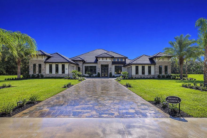 One or more photo(s) has been virtually staged. Modern Luxury Meets Old Florida Serenity at The Estates at Brown's Landing. Experience a rare blend of architectural mastery and natural tranquility in this custom-built 1.6-acre sprawling luxury estate. Situated on a private cul-de-sac bordering the protected Spruce Creek ecosystem, this 4,023 sq. ft. residence offers a ''country'' feel with a location that keeps you minutes from everything.  Featuring 4BR, 4.5 baths, home office, designated exercise room, 4 Car Garage, Pool, Spa, and so much more.  Step through contemporary front doors into a home defined by exquisite fixtures, thoughtful lighting, and refined architectural details. The open-concept layout features oversized rooms and an overall feeling of grandeur.  In the Great Room, soaring ceilings with wood beams and a stunning stacked stone wall create a sophisticated yet warm focal point for entertaining.Modern Luxury Meets Old Florida Serenity at The Estates at Brown's Landing.  Experience a rare blend of architectural mastery and natural tranquility in this custom-built 1.6-acre sprawling luxury estate. Situated on a private cul-de-sac bordering the protected Spruce Creek ecosystem, this 4,023 sq. ft. residence offers a ''country'' feel with a location that keeps you minutes from everything.  Featuring 4BR, 4.5 baths, home office, designated exercise room, 4 Car Garage, Pool, Spa, and so much more.  Step through contemporary front doors into a home defined by exquisite fixtures, thoughtful lighting, and refined architectural details. The open-concept layout features oversized rooms and an overall feeling of grandeur.  In the Great Room, soaring ceilings with wood beams and a stunning stacked stone wall create a sophisticated yet warm focal point for entertaining.