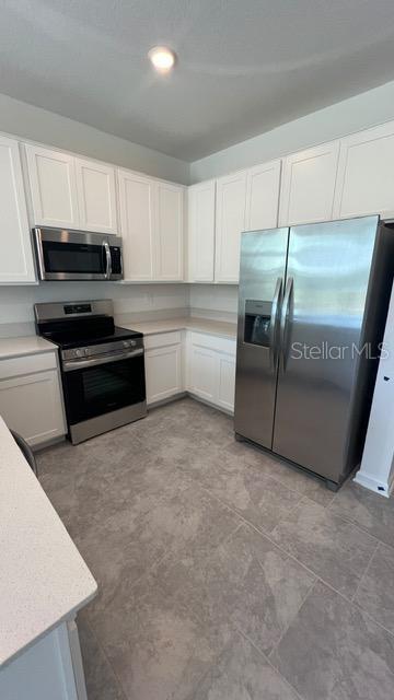 Photo of 3263 Laurent Loop, Davenport, FL 33837 (MLS # O6449175)