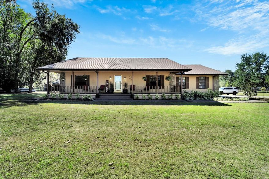 Discover your ideal country estate that is well maintained by the original owners, affordable, conveniently located and turn-key ready! This charming 5 bedroom, 3 bathroom residence sits on nearly 8 acres of high and dry land and offers exceptional features. This home has been recently updated throughout, boasting a recently remodeled Kitchen, all of the bathrooms and the oversized 5th bedroom.  As you explore this adorable property, you'll find the most quaint screened in back porch, a lovely sitting gazebo perfect for an afternoon tea while watching the sunset, and a remarkable 60'x65' 5-stall horse barn complete with a feed storage and spacious air-conditioned workshop.  This haven is only minutes away from the I-4 corridor,  grocery stores, shopping centers, and excellent dining options. Imagine hosting gatherings with friends and family on this beautiful property, creating cherished memories that will last a lifetime. Don't miss the chance to witness this unique gem for yourself. Schedule a private tour today and explore the endless possibilities that await you.