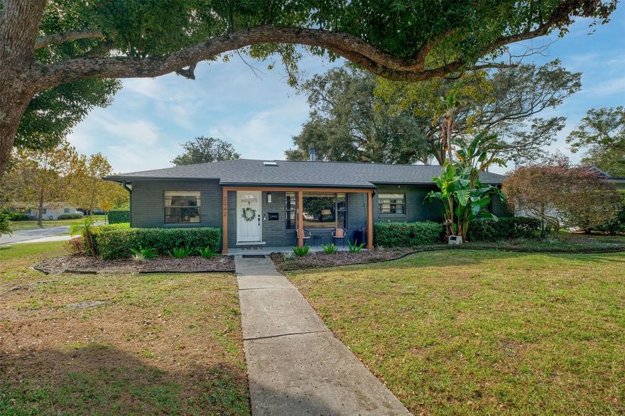 This charming and affordable Winter Park abode offers its next owners loads of possibilities: from building your own dream home on the best lot in the neighborhood to enjoying what’s already here.
2042 Yorkshire Drive is a nearly quarter acre (.24) corner lot in desirable Winter Park with sought-after schools: Lakemont Elementary, Maitland Middle, and Winter Park High. Beautiful views from the kitchen window and dining room overlook the charming pond of The Mayflower Winter Park, and imagine what a view could be had from the second story of a new home built on the lot. Luxury homes are being built all around in this neighborhood. 
Currently, this 3 bed, 2 bath home has approximately 1,700 sq ft including a large mud-room/utility room and a new bonus room (extra 120+ sq ft not included in property record sq ft) leading to the backyard covered porch. NEW Roof 2023, NEW HVAC 2023, updated electric and replumb with CPVC.
Stepping inside the great room, beautiful hardwood floors and wood burning fireplace with stacked stone surround are sure to please. An ample size dining room leads to the updated kitchen with stainless steel appliances, granite counter tops, and white wood cabinets. Down the main hallway are 2 guest bedrooms, beautifully updated hall bathroom with tub/shower combo, and the primary bedroom with updated ensuite with walk-in shower. 
Outback, the covered porch is perfect for your home grill master, and the large yard is ideal with space for kids to play on the premium turf and for pets to run around in the fully fenced real grass space. Not on a cut-through street, so solitude and quiet abound despite the close location to the best of Winter Park – YMCA Fitness is just around the corner, as is Sprouts, Publix, the shops and restaurants of Park Avenue (2 miles away), and Winter Park Village (10-minute drive). Zoned A-1 with no HOA or CDD, live in the property as-is, rent it out, or tear it down and build your dream home in this fabulous location. Lot dimensions: 136x80x110x61.