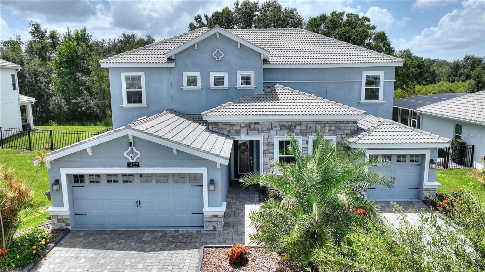 LIVE LIKE A CHAMPION! NEXT-GEN LIBERATION MODEL WITH PRIVATE POOL, IN-LAW SUITE, RENOVATIONS, AND FULL GOLF MEMBERSHIP INCLUDED IN HOA! One of the finest homes in ChampionsGate, this 6-bedroom, 4-bath residence is loaded with upgrades and sits on a premium private conservation lot, offering serene views and exceptional privacy. The heart of the home is the fully remodeled kitchen, featuring an oversized island, Cambria quartz countertops, additional custom cabinetry, and built-in dinette and pantry, perfect for entertaining and daily living. The main living area offers an open-concept layout, upgraded lighting, crown molding, and custom finishes throughout. Upstairs, you’ll find luxury vinyl plank flooring, plush new carpet, and a remodeled primary bath suite with a custom-built primary closet. Step outside to your private oasis: a custom saltwater pool with sun shelf, water feature, and professionally designed landscaping with concrete curbing for added elegance and curb appeal. This unique Next-Gen floor plan includes a private in-law suite with a separate entrance, living room, kitchenette, bedroom, full bath, laundry, and its own 1-car garage, ideal for guests or multigenerational living. Additional features: plantation shutters, electric shades, upgraded lighting, and a 3-car garage. Enjoy golf cart access throughout the gated, resort-style community with world-class amenities: Oasis Club with restaurant, tiki bar, lazy river, pools, fitness center & more. The Plaza, a residents-only clubhouse with restaurant, bar, pickleball, and two pools. The Retreat Club, a new full-scale water park.
HOA includes: full golf membership, access to all clubs and amenities, tennis, pickleball, $75 monthly food credit, gated entries, lawn care, cable, internet, phone, security monitoring, and more. CDD and trash included in taxes.
Minutes to Disney, shopping, and dining—this is resort living at its finest!