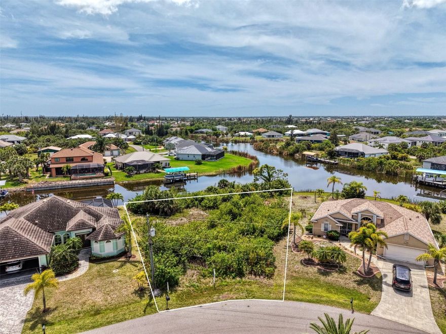 Rare opportunity to own over 150 feet of waterfront on a true canal lot with Gulf access in South Gulf Cove—one of Southwest Florida’s best-kept secrets for boating and coastal living. This oversized homesite offers long water views, southern rear exposure for all-day sunshine, and plenty of space to design a custom home with a pool and outdoor living area. Electric is already at the site, and the property is connected to public water and sewer, making your build process smooth and convenient. Even better, this lot is not located in a Scrub Jay zone. Enjoy direct access to over 55 miles of navigable canals leading out to open Gulf waters—perfect for boating, fishing, and waterfront enjoyment. Surrounded by well-maintained waterfront homes, this location offers both beauty and long-term value. South Gulf Cove features a public boat ramp, parks, walking trails, and low optional HOA fees of just $120 annually. Located just minutes from Boca Grande and Manasota Key beaches, top-rated golf courses, shopping, dining, and spring training facilities, this property blends convenience with a laid-back coastal lifestyle. Whether building now or holding as an investment, this is one of the best-priced waterfront lots in South Gulf Cove—a standout opportunity to secure your piece of Florida waterfront living.