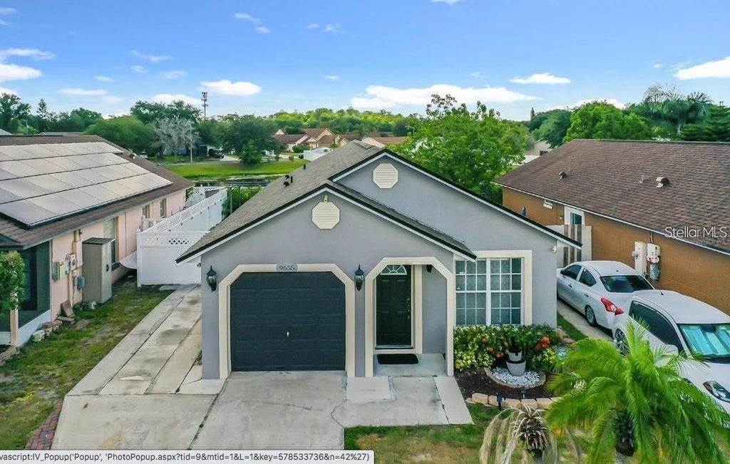 Photo of 9655 Hollyhill Drive, Orlando, FL 32824 (MLS # O6426086)