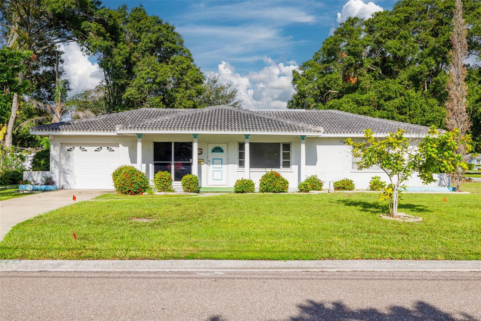Fixer Opportunity on Oversized Corner Lot! Located in the quiet and established Harshaw neighborhood of St. Petersburg, this 2 bedroom, 1 bath home sits on an oversized corner lot and offers an excellent opportunity for investors, builders, or buyers ready to renovate and create something special. The lot provides ample room to add a 2 car garage and a circular driveway with access from both streets. Inside, the flexible floor plan allows for the addition of a third bedroom and second bathroom, with the potential to create a true primary suite. The existing garage already includes a shower and plumbing, making it ideal for conversion into additional living space with minimal expense. Set in a well-kept neighborhood just minutes from US-19 and I-275, this location offers quick access to downtown St. Pete, Tampa International Airport, Sarasota, and the Gulf beaches. Located in Zone X, the property is outside the flood zone—no flood insurance required—and in a non-evacuation area offering peace of mind. Whether you're planning a full renovation or looking to customize every detail, this is a rare opportunity to reimagine a solid block home in one of St. Pete’s most desirable and established communities.