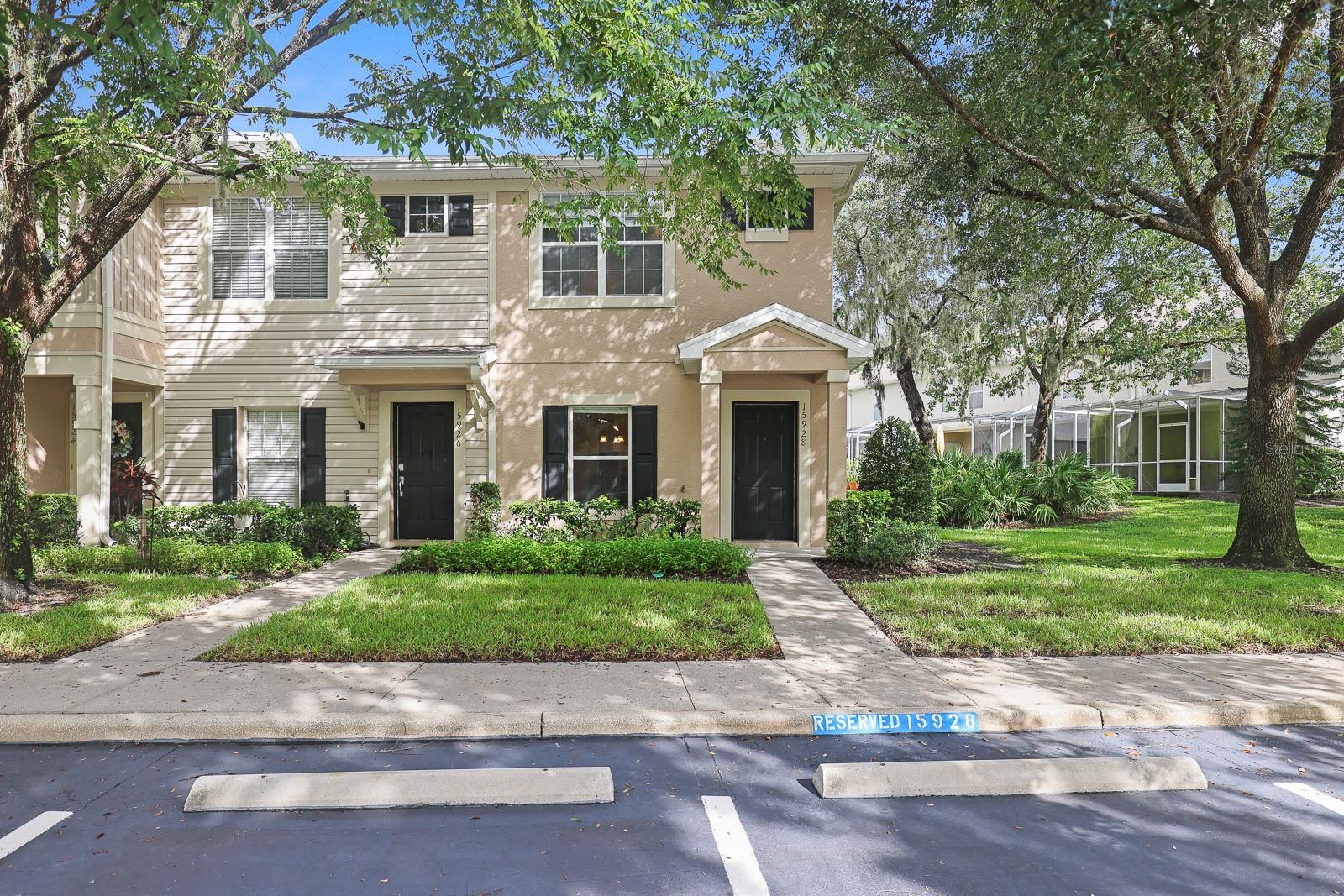Welcome to this beautifully maintained townhome in the gated community of Fishhawk Ridge. Offering 1,248 square feet of living space, this home features two bedrooms, each with its own en-suite bathroom, plus a convenient powder room on the first floor. The open living and dining room combination flows seamlessly into the spacious kitchen, complete with 42” cabinets, quartz countertops, a kitchen island, and a stylish subway tile backsplash. Sliding doors lead to a covered and screened lanai with an additional storage closet, perfect for enjoying the outdoors. The first floor and bathrooms showcase upgraded tile plank flooring, while newer carpet provides comfort in the bedrooms. Additional updates include a roof replacement in 2020, a new hot water heater in 2025, and a new HVAC system in 2025. One assigned parking space is included, with plenty of guest spots nearby, and lawn care is fully maintained by the HOA for a low-maintenance lifestyle. Residents of Fishhawk enjoy access to an array of amenities, including pools, fitness centers, clubhouses, dog parks, miles of trails, pickleball and tennis courts, basketball courts, and even a county skate park. Conveniently located near shopping, dining, and offering easy access to I-75 and Highway 301, this townhome combines comfort, style, and a vibrant community atmosphere.