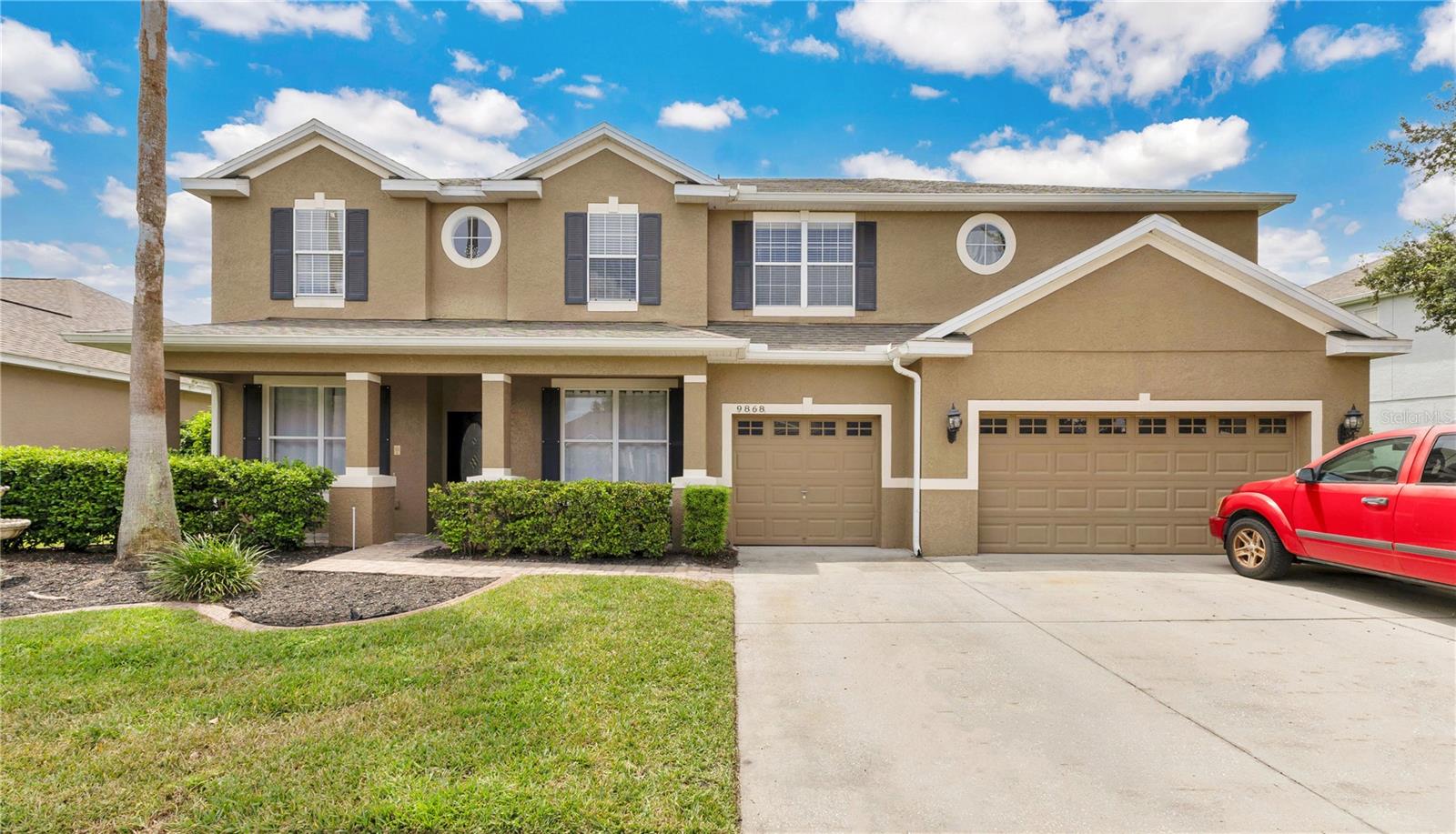 This 6-bedroom, 3.5-bath pool home in the gated North Shore at Lake Hart doesn’t just check boxes — it stretches the list. The curb appeal starts with a clean exterior and three-car garage, but it’s the space and layout inside that really deliver, offering room to grow and a private backyard with no rear neighbors. Step into a sunlit foyer that opens to both the formal living and dining rooms before flowing into the open kitchen-and-family room. The gourmet kitchen is a standout with granite countertops, newer appliances, a breakfast bar, and a walk-in pantry, creating the perfect hub for gathering. Upstairs is where this floor plan shines. Generously sized bedrooms surround a spacious central loft that works as a second living area, retreat, or play space. The primary suite is massive, complete with dual walk-in closets and a bathroom featuring two vanities, a soaking tub, and separate shower. Topping it off is a dedicated home theater with space for true stadium seating — movie nights and game days just got an upgrade. Out back, everyday living shifts outdoors to a wide, covered lanai that stretches the length of the house and a screened-in pool framed by tropical landscaping and total privacy. North Shore at Lake Hart is golf-cart friendly and packed with amenities: an 18-hole golf course, large pool, basketball and tennis courts, baseball field, playground, dog park, fitness center, and scenic parks and trails with charming street lighting, plus direct access to boatable Lake Hart for fishing and water sports. With Lake Nona’s Medical City, the USTA National Campus, Orlando International Airport, and the 417/528 minutes away, commuting is easy and weekends are wide open.