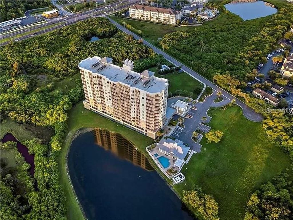 Photo of 10851 Mangrove Cay Lane NE #1212, St Petersburg, FL 33716 (MLS # TB8440583)