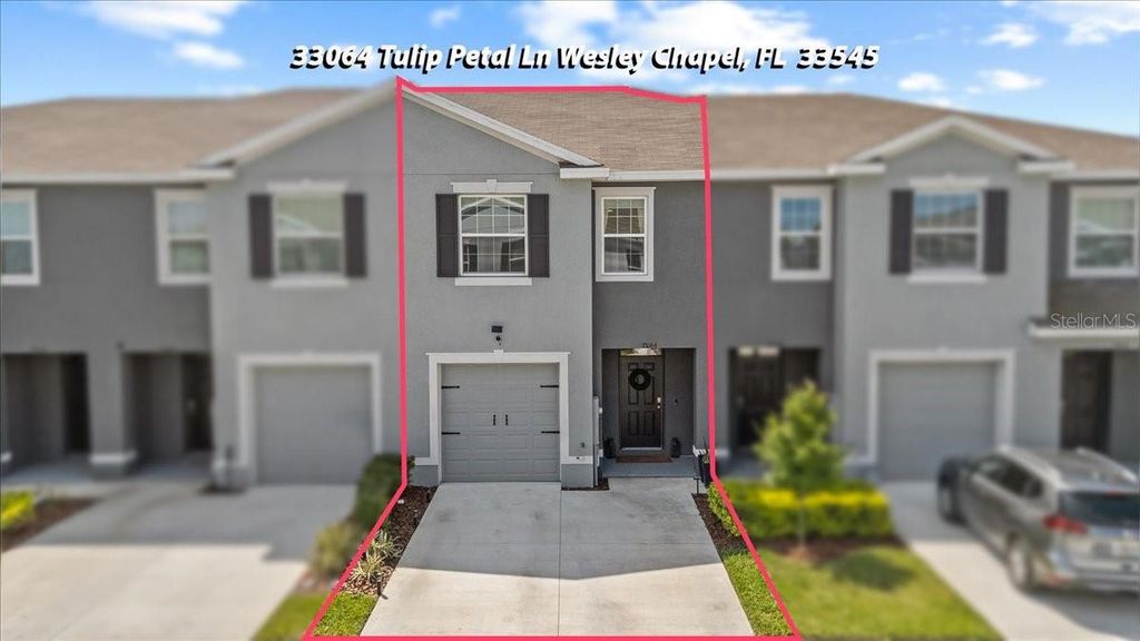 Photo of 33064 Tulip Petal Lane, Wesley Chapel, FL 33545 (MLS # TB8466843)