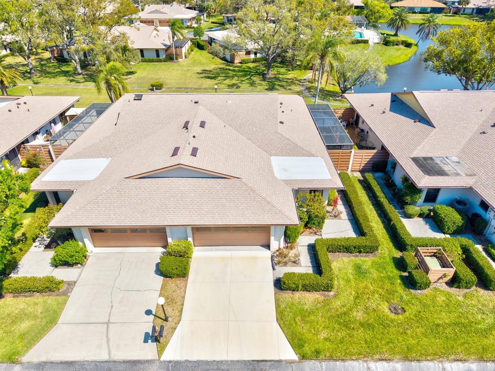Turn Key and Motivated Seller -- Why settle for less when you can enjoy the Florida lifestyle in this beautifully maintained, maintenance-free villa in Center Gate Estates? This 3-bedroom, 2-bathroom home lives like a single-family residence, featuring a well-designed split floor plan ensuring privacy, with the primary suite separated from the guest bedrooms. The windows and skylights provide natural light while the open-concept family room is structured with cathedral ceilings, connecting to the enclosed Florida room—perfect for enjoying peaceful views of the green lawn and tranquil pond.
A spacious eat-in kitchen offers ample cabinet storage and counter space, overlooking the great room for an easy flow of the floor plan. Recent updates include: fresh interior paint, cement Lanai 2020, sky light replaced 2021, hot water heater 2022, dryer 2022, guest bedroom flooring 2022, Roof 2023, kitchen appliances 2023, Air conditioner 2024, electrical panel upgrade 2024, Lanai screens replaced 2024, Lanai wood fence replaced 2024, washer 2024, driveway 2024, and brand-new window treatments. The master and spare bedrooms each have sliding doors leading to a large screened-in lanai, now enhanced with new concrete and a freshly installed fenced wall.
Additional features include a utility/mud room off the kitchen and garage, a two-car garage with epoxy-coated flooring, an electric car charging outlet, and a mini-split A/C system for the front bedroom and garage—ensuring comfort even on the hottest Florida afternoons.
Located in a peaceful 55+ community, this villa offers privacy while being just minutes from shopping, dining, medical facilities, and Sarasota’s world-famous beaches. Easy access to I-75 makes commuting a breeze. Don't miss out on this opportunity—schedule your private showing today!