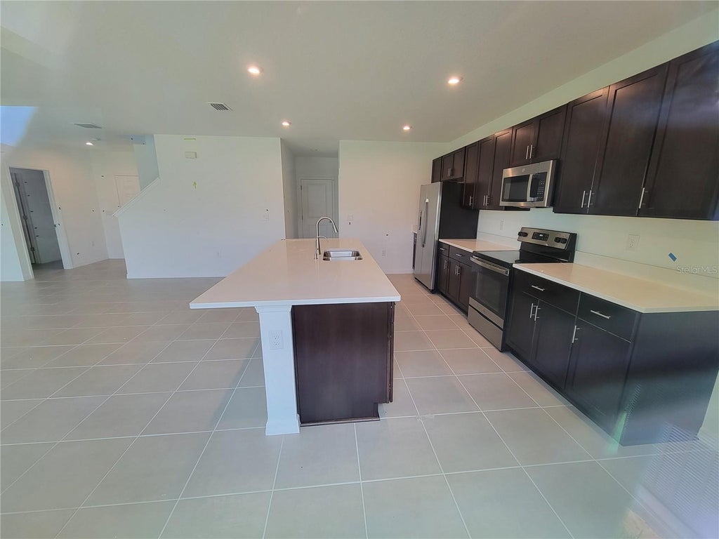 Photo of 5651 Costa Blanca Way, Davenport, FL 33897 (MLS # O6443445)