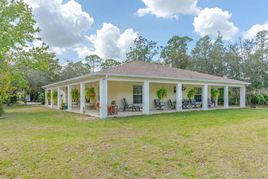 Don't miss out on this awesome New Smyrna Beach compound with privacy galore! This 3/2 block home has a gorgeous wrap around porch which surrounds 3 sides of the house. The 4th side is occupied by a huge 3+ car garage/workshop that would be any car, motorcycle or woodworker enthusiast dream! Built in 2003 and is surrounded by nature, complete with deer and birds galore. Outside you will find tons of room with a paver patio & firepit. Located just down the street from the wonderful Swoop Municipal Boat Ramp and intracoastal waterway and just a short drive to the amazing Canal St and Flagler Avenue shopping areas of artsy New Smyrna Beach. ;Water: City