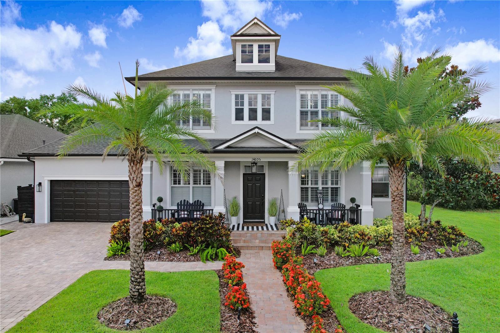 Welcome to your dream home in the highly sought-after community of Highland Park, just minutes from Westchase! This beautifully updated two-story residence offers the perfect blend of comfort, style, and thoughtful design, featuring 4 spacious bedrooms, 3.5 baths, and a large bonus room—ideal for today’s dynamic lifestyle. From the moment you step inside, you’ll appreciate the quality craftsmanship, elegant finishes, and curated architectural details. Gorgeous hardwood floors and wood-look tile flow throughout the main level, offering warmth with low-maintenance durability. The family room is a true showstopper, with a feature wall of natural stone and an electric fireplace—creating a cozy, stylish focal point. Decorative trim enhances the kitchen and primary suite, while a reclaimed wood mantle adds rustic charm to the fireplace in the owner’s retreat. Plantation shutters, crown molding, shiplap accents, and designer touches elevate the home’s timeless appeal. At the heart of the home, the stunning updated kitchen features a gas range, farmhouse sink, built-in oven and microwave, and granite countertops. Custom cabinetry and a built-in banquette with hidden storage offer both beauty and function—perfect for casual dining or entertaining. The luxurious first-floor primary suite is a serene escape, complete with its own electric fireplace, custom walk-in closet, and spa-inspired bath. Enjoy a soaking tub, dual vanities, makeup station, and oversized walk-in shower with rain head for an indulgent experience. Downstairs, a stylish half bath also serves as a pool bath for future outdoor enhancements. Shiplap accents add farmhouse flair throughout. Upstairs, three spacious bedrooms include a convenient Jack and Jill bath, ideal for family or guests. A large bonus room offers endless options—playroom, media room, or office. With 3.5 baths total, everyone enjoys space and privacy. Step outside to your private backyard retreat with a free-form pool, tranquil water features, brick pavers, and a covered patio with tongue-and-groove wood ceiling—perfect for entertaining or relaxing. The fully fenced yard offers plenty of room for pets and play, making the most of Florida’s sunshine. As a Highland Park resident, enjoy access to The Lake House—a scenic amenity center with a clubhouse, resort-style pool, fitness center, playground, and walking trails along Galt Lake. It’s a peaceful hub for neighborhood events, workouts, and lakeside views. You’ll also love Highland Park’s boutique retail village, offering walkable convenience to favorites like The Fountainhead Wine Bar, Tampa Pizza Company, Alchemy Wellness Spa, and Barre3 Studio—adding an urban village vibe to this tree-lined setting. Located in an A-rated school district and close to top-rated schools, Ed Radice Park, and the vibrant Westchase area, this location truly has it all. This is a rare opportunity to own a move-in ready home with high-end finishes, a versatile layout, and an unbeatable location in one of Tampa’s most desirable communities. Schedule your private tour today and experience everything this exceptional home has to offer!