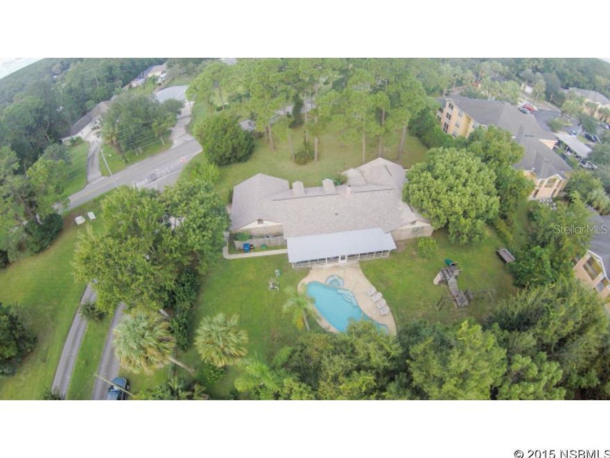 Wonderful Large 4 Bedroom Family Home on a Corner Lot with a Pool, On Almost an Acre of Land, and Yet 15 Minutes to the Beach. Great Wooded Lot in the Front, and a Large Patio Area in the back. Lots of Space and Potential, Perfect for People that need Room.. Large Wood Burning Fire Place.Make Your Appointment Today !!!!!!!!