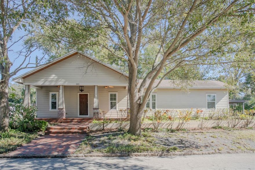 One or more of the photos was virtually staged.  Absolutely “Charming” Bungalow overlooking Crescent Lake Park!  Built in 1938 with substantial renovations in 2007 (plans available), this 3 bedroom, 2 bath home features original wood flooring throughout with spacious bathrooms and lots of closet space (walk-in closet in Primary Bedroom).  The lovely kitchen has 42” cabinetry, stone counters, natural gas range and reverse osmosis for the kitchen sink…as well as a water softener for the entire home.  The primary bath has dual sinks and a large walk-in shower, while the hall bath is quite spacious with another large walk-in shower and claw bathtub.  This bathroom also has a convenient inside utility closet with washer and dryer!  With natural gas, you have gas cooking and a gas tankless hot water heater!  As you approach the front of the home, you will see a beautiful brick walkway and front porch that Bungalows are known and appreciated for!!  Out of the rear door is an amazing decorative stone patio from years gone by that adds authenticity to this lovely property.  Situated on a corner lot, there is a long driveway, carport and nice shed for your outdoor storage.  Seller has approved plans for ADU w/2 car garage and 1 bedroom/1 bath upstairs.  Crescent Lake is well known for its beautiful park, playground and walking path around the lake, plus very active tennis and pickleball courts for your outdoor sporting activities!  You are minutes away from downtown St. Petersburg with fabulous restaurants, parks, marinas, museums, sporting events  and so much more!  Easy commutes to Tampa and St. Pete/Clearwater airports and best of all, only 15 to 20 minutes from the beaches!