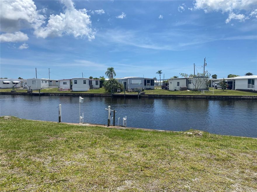 Build your Dream Florida retreat on this canal-front interior lot along the scenic Myakka River, located in the sought-after 55+ BOATING COMMUNITY of Harbor Cove in North Port. This vacant homesite offers a fantastic opportunity to place a new mobile home in a well-established neighborhood known for its friendly atmosphere and relaxed coastal lifestyle. Residents of Harbor Cove enjoy a wide range of amenities along with an active social calendar, creating a vibrant and engaging community environment. The location is also highly convenient—just minutes from shopping, dining, medical facilities, and the beautiful Gulf Coast beaches. Whether you're envisioning a seasonal getaway or a full-time residence, this property is a blank canvas ready for your personal touch.