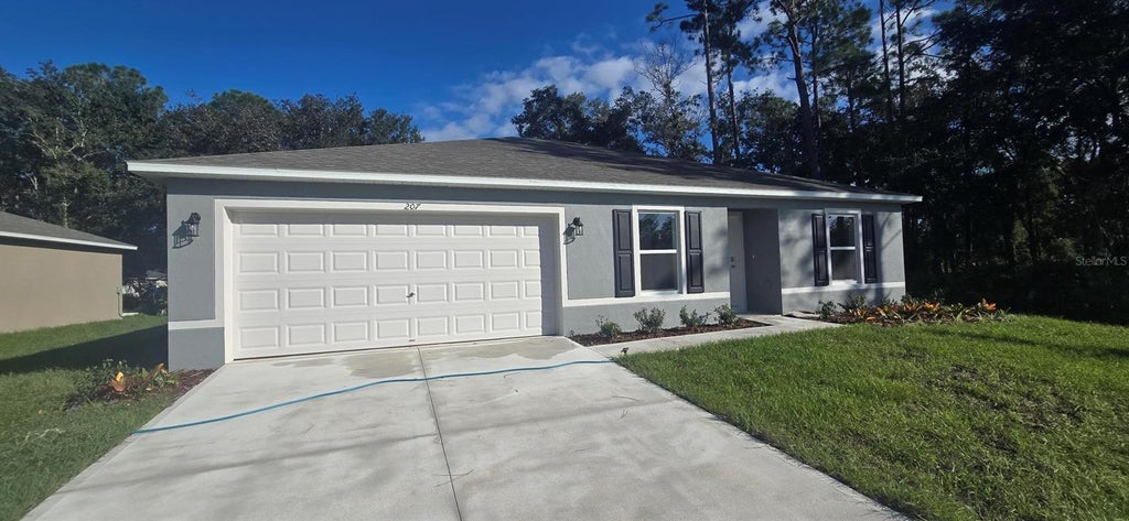 Photo of 207 Spoonbill Lane, Poinciana, FL 34759 (MLS # C7532188)