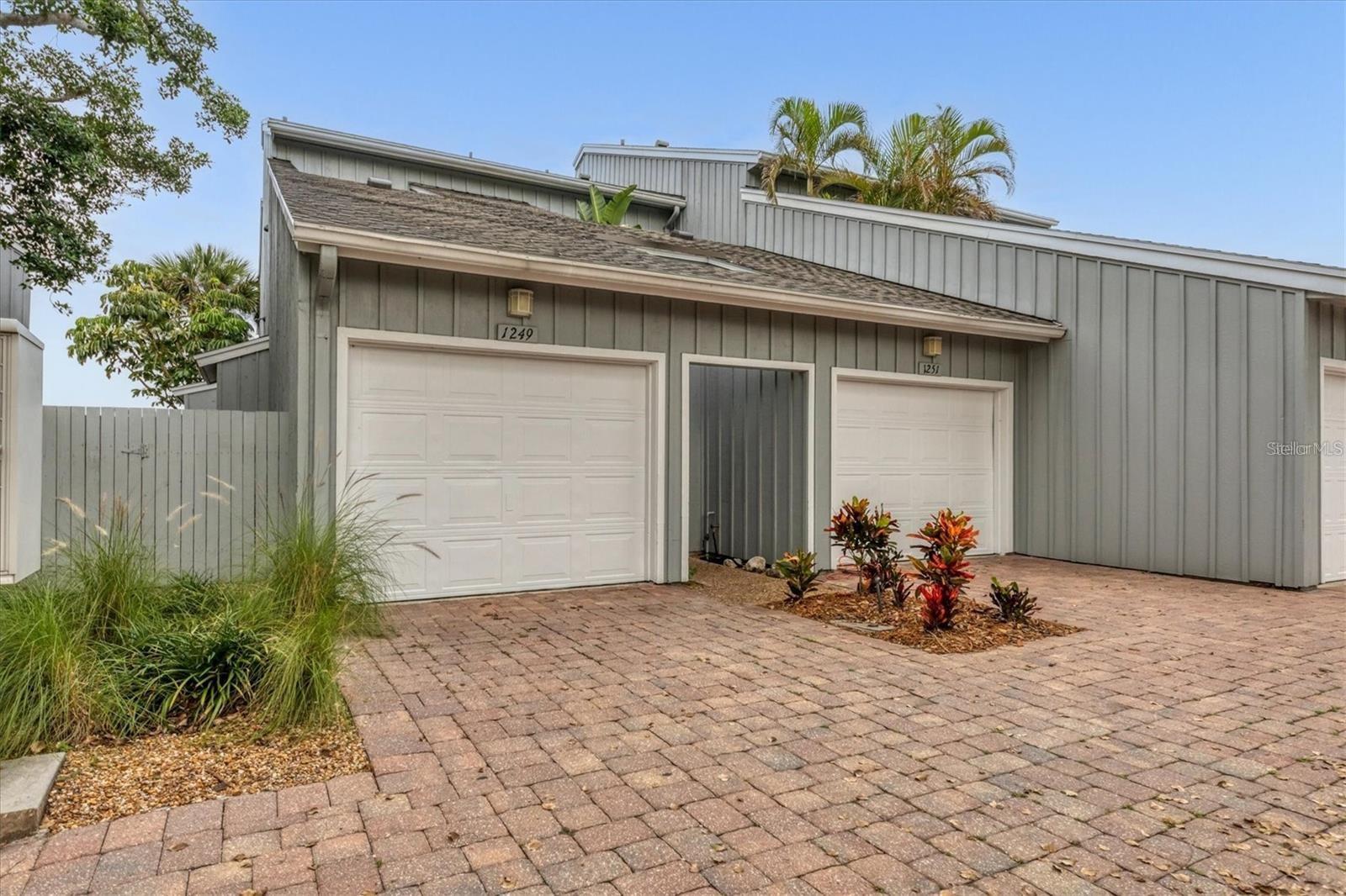 LOCATION< LOCATION< LOCATION! Welcome boating and beach lovers. This 2 bedroom, 2 bath first floor condo with a one car garage on Siesta Key will fulfill all your dreams! Spend the day on the famous Siesta Key Beach (just steps away) then take a sunset boat ride from your own boat slip! Play tennis/pickle ball on the private courts, lounge by the pool or fish out your back door. This condo is being offered turnkey furnished. Updated kitchen with granite countertops and stainless-steel appliances. The kitchen is open to the dining and living rooms with lots of light. Enjoy water views from the screened lanai, while watching fish jump and manatees play. The large master bedroom has an ensuite bathroom with a double vanity and walk in closet. Harbour Towne is a gated community of 50 waterfront units and the amenities include a heated pool, hot tub, tennis/pickle ball court, clubhouse and a picnic area with grills. Walk or take the trolley to lively Siesta Key Village with its many restaurants and shops. Florida living at its best!