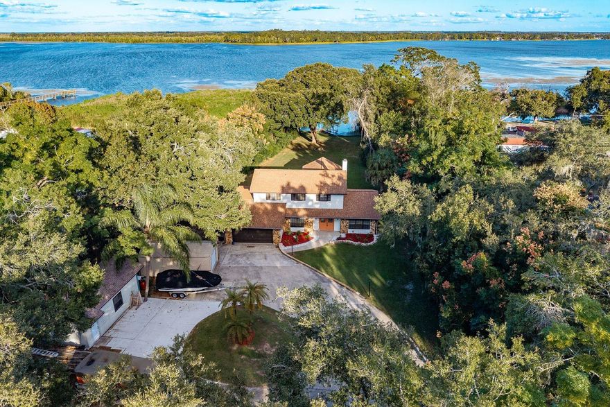 Welcome to your stunning lakefront home on Lake Griffin and dream retreat! This beautifully updated lakefront property offers five spacious bedrooms and four modern bathrooms .The updated kitchen is a chef's delight with the brand-new appliances and sleek finishes,while the bathrooms have been tastefully updated. Relax and entertain with ample parking for guests ,and enjoy the gorgeous outdoor deck that offer stunning views of Lake Griffin . The cozy fireplace in the living room adds warmth and charm, creating a perfect ambiance, Take advantage of the additional lot,offering endless possibilities for expansion or future building. The home also includes a spacious two car garage,storage shed,and stunning built in features! This property truly has it all. Don't miss out on this exceptional opportunity to own a slice of paradise ! Tour today, Buy Tonight !