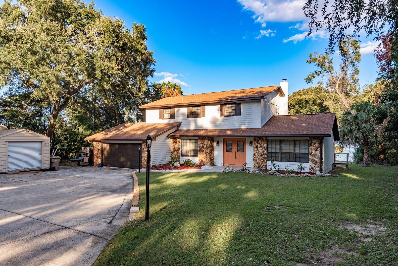 Welcome to your stunning lakefront home on Lake Griffin and dream retreat! This beautifully updated lakefront property offers five spacious bedrooms and four modern bathrooms .The updated kitchen is a chef's delight with the brand-new appliances and sleek finishes,while the bathrooms have been tastefully updated. Relax and entertain with ample parking for guests ,and enjoy the gorgeous outdoor deck that offer stunning views of Lake Griffin . The cozy fireplace in the living room adds warmth and charm, creating a perfect ambiance, Take advantage of the additional lot,offering endless possibilities for expansion or future building. The home also includes a spacious two car garage,storage shed,and stunning built in features! This property truly has it all. Don't miss out on this exceptional opportunity to own a slice of paradise ! Tour today, Buy Tonight !