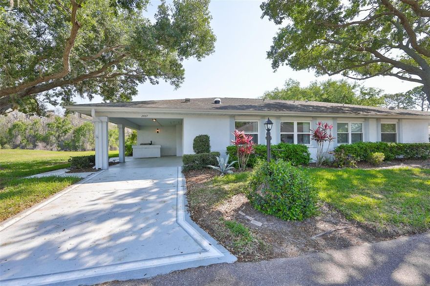 Welcome to 2007 N Halcyon Drive – Where Coastal Charm Meets Carefree Living! This home is being SOLD just as you see it, fully furnished and beautifully decorated. 

Nestled within the gated 55+ community of Kings Point in Sun City Center, this beautifully maintained 2-bedroom, 2-bathroom home offers the perfect blend of comfort, style, and peaceful surroundings.

From the moment you arrive, you’ll appreciate the spacious lot, serene water view, and the presence of a mature oak tree providing both shade and privacy. This home radiates pride of ownership and invites you into a relaxed, coastal-inspired retreat.

Step inside through the welcoming entry with a decorative glass door insert and immediately feel the light, airy ambiance. The open floor plan is complemented by ceramic tile flooring throughout (no carpet!), creating a seamless and low-maintenance living space. A charming wood plank accent wall adds warmth and character, enhancing the home’s inviting beachy feel.

The kitchen has been thoughtfully updated with a solar tube for natural light, refinished ceiling, and can lighting on dimmer switches, creating both functionality and ambiance. The home also features updated bathroom sinks, square tile finishes, and ample storage throughout. Refrigerator, Dishwasher, Washer and Dryer are 3 years new and the Air Conditioner is under 8 years old.

Enjoy the convenience of in-home laundry within the side garage, a covered carport, and dedicated golf cart parking/storage—perfect for embracing the Kings Point lifestyle.

Step out onto the screened-in lanai, where you can unwind and take in the peaceful pond view in the distance—a perfect setting for morning coffee or evening relaxation.

This home is being offered furnished as a package, making it truly move-in ready and ideal as a seasonal getaway or full-time residence. The homeowner has proactively brought the home up to code by replacing the electrical panel, offering added safety and peace of mind for the next owner. 
Located in the heart of Sun City Center, Kings Point is a premier gated community known for its vibrant, resort-style living. Residents enjoy:
 Two stunning clubhouses, Indoor and outdoor pools, including lap and leisure pools, State-of-the-art fitness centers and spa facilities, Tennis, pickleball, and golf nearby, An 850-seat Veterans Theater for live entertainment, Over 200 clubs and social activities, On-site dining, a tiki bar, and community events.
Your monthly fees typically cover essentials such as lawn care, exterior maintenance, roof replacement, cable, internet, water, sewer, pest control, and 24-hour gated security, allowing you to truly enjoy a maintenance-free lifestyle.

Perfectly located between Tampa and Sarasota, with easy access to world-class Gulf beaches, shopping, dining, and medical facilities—this is Florida living at its finest.
Homes like this in Kings Point don't last-Schedule your showing today before it's gone!
