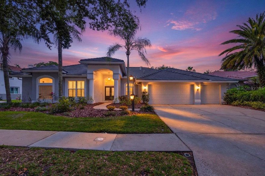 Ideally situated on a premier conservation homesite within the gates of the coveted Osprey Pointe enclave in Hunter’s Green Country Club, this beautifully updated residence is ready for its new owners! Thoughtfully designed, the home features 4 bedrooms plus a dedicated office and a three-car garage, along with engineered hardwood flooring throughout, creating warmth and continuity across the living spaces. A gracious entry welcomes you with formal dining and living rooms that transition seamlessly into the expansive open-concept family room and chef’s kitchen. The kitchen is a true centerpiece of the home, appointed with beautiful lighting, custom cabinetry, quartz countertops, and a generous island designed for both gathering and entertaining. Culinary features include double KitchenAid ovens, a stainless-steel KitchenAid refrigerator, a gas range, two built-in wine refrigerators, elegant gold hardware, a butler’s pantry with abundant storage and counter space, and a thoughtfully designed coffee bar. The desirable split-bedroom layout offers privacy and balance, with the primary suite and office situated on one wing of the home and three additional bedrooms positioned on the opposite side. The primary retreat opens directly to the pool area through sliding glass doors and includes two walk-in closets along with a serene spa-inspired bath designed for relaxation and comfort. Designed for effortless indoor-outdoor living, the exterior showcases an expansive lanai overlooking a private saltwater pool and oversized hot tub. The covered seating area and fully equipped outdoor kitchen, complete with a grill, sink, and beverage refrigerator create an exceptional setting for entertaining. The pool and spa provide a tranquil escape, with the hot tub comfortably accommodating up to eight guests. Located within the highly sought-after Hunter’s Green community, this residence offers a rare combination of privacy, convenience, and lifestyle, with proximity to schools, premier medical facilities including Moffitt Cancer Hospital, Advent and BayCare, exceptional shopping and dining, and convenient access to I-75. The community itself features extensive amenities including designated bike lanes, playgrounds, illuminated sports courts and fields, a scenic jogging trail with a fitness circuit, and an off-leash dog park, with optional membership available at Hunter’s Green Country Club and close proximity to Flatwoods Nature Park. An exceptional opportunity to experience refined living in one of Tampa’s most distinguished communities.